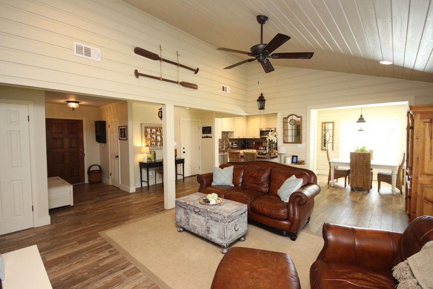 Fully renovated, all-brick home with 1515 Square feet and 3 bedrooms/2 baths only minutes from the white sandy beaches of Destin, FL! Put your boat in at Joe's Bayou near the home and boat to the Destin Harbor in minutes to enjoy Noriego Point and Crab Island! The home was remodeled in 2014 to feature new double pane windows, copper wiring with new electrical panels, flooring, lighting, kitchen, baths, interior doors, crown molding/trim, paver patio, rock pad for boat parking, professionally painted interior and exterior, and so much more! Enter the home through the antique, solid wood door front door into the foyer and notice the new wide plank tiled floors throughout! The home features an open floor plan with the kitchen and dining rooms opening to the living room.