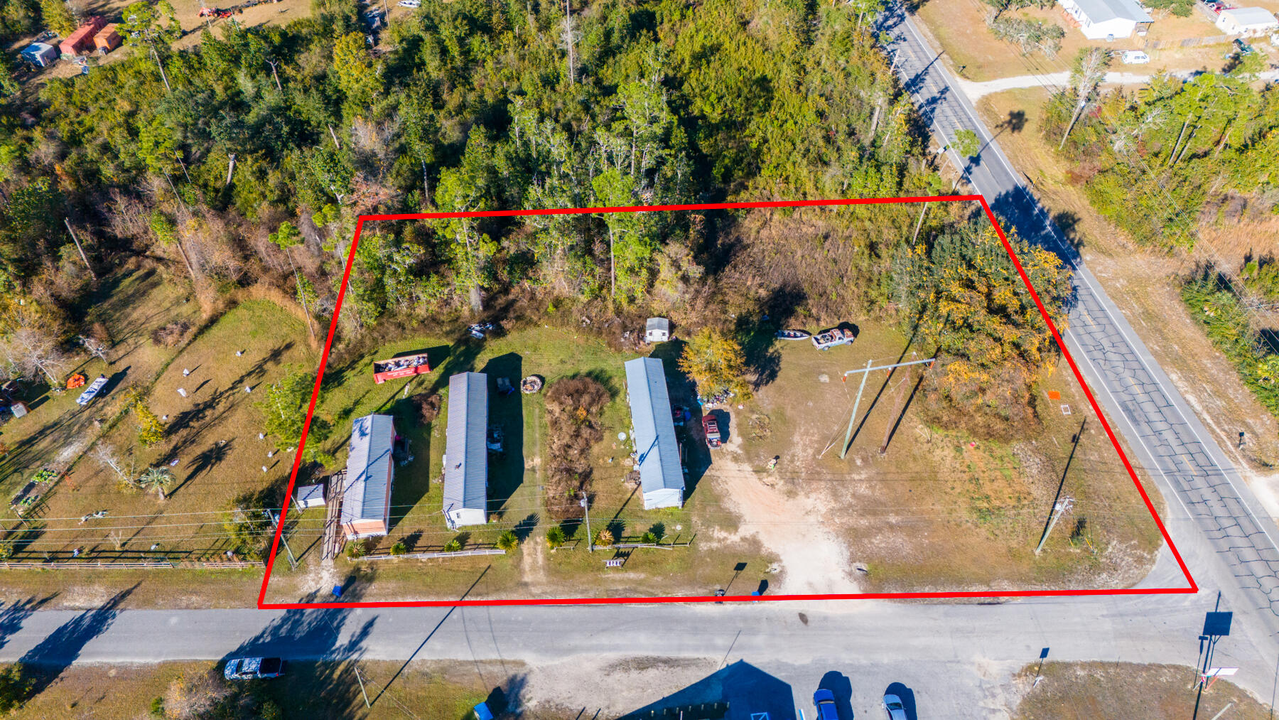 This 1.275-acre parcel is ready for a savvy investor who is ready to CASH FLOW! This property offers 3 units, 2 rented at $1,600/month with the potential to rent the third unit for a total of $2,350/month! Zoning is R-2 and allows for single family homes or duplexes for future development. Each unit is currently on its own well/septic and the property previously had a 4th unit on site. This MULTI-FAMILY opportunity is a great option for investors who want to cash flow from day 1 and hold the property for future development. Positioned in the Bayou George/Youngstown area of Panama City, Florida - this property is located with a few miles of Publix, restaurants, schools and a sports complex. All information provided must be verified by Buyer, if important. Property is occupied by tenants. Please do not disturb tenants.