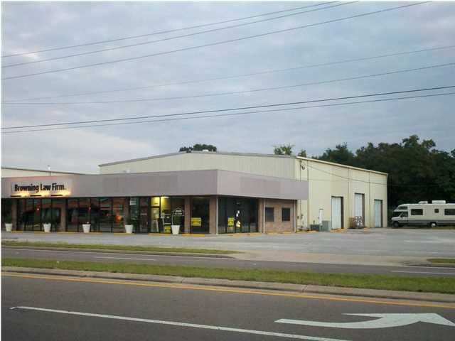 Corner location across the street from Publix. The building is improved with 8,000 square feet of warehouse and 3,000 square feet of office/showroom space, 3 phase power, 3 ton overhead crane, 3 roll up doors, 24 foot eve height in the warehouse area, 220 volt air compressor, paved parking for 40 cars, and a bonus loft area of 1,700 square feet for extra storage space.