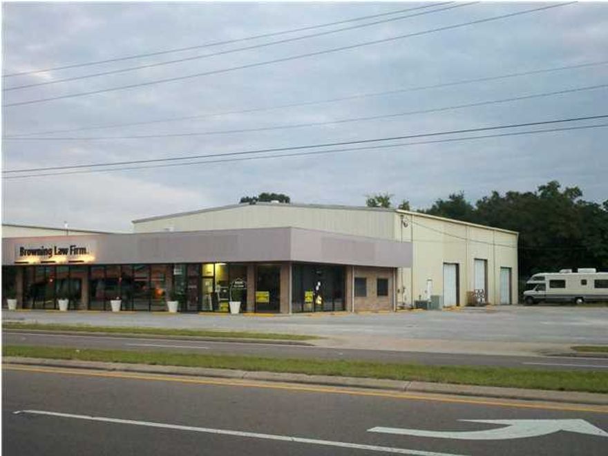 Corner location across the street from Publix. The building is improved with 8,000 square feet of warehouse and 3,000 square feet of office/showroom space, 3 phase power, 3 ton overhead crane, 3 roll up doors, 24 foot eve height in the warehouse area, 220 volt air compressor, paved parking for 40 cars, and a bonus loft area of 1,700 square feet for extra storage space.