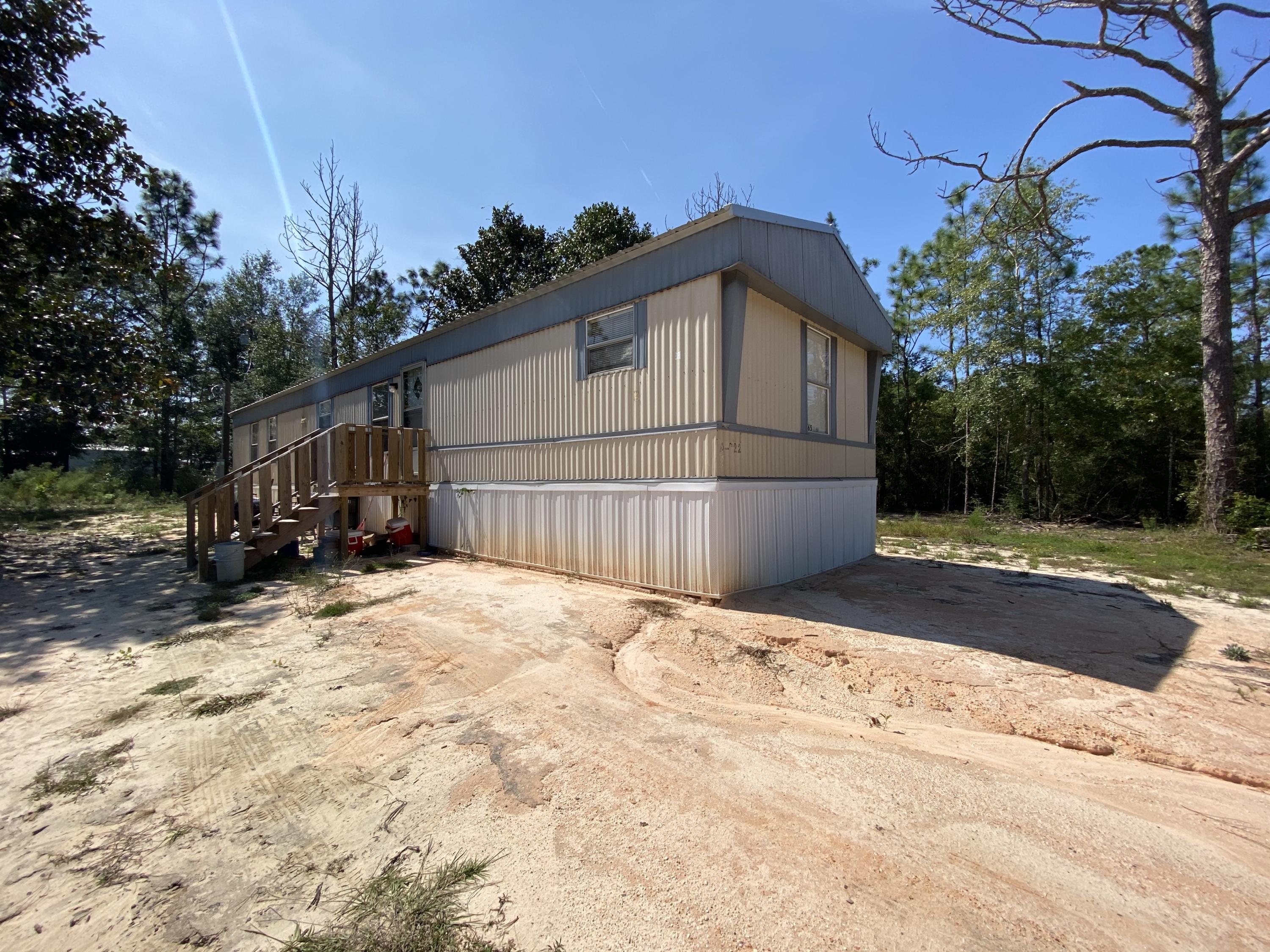 INVESTMENT OPPORTUNITY!!! Affordable mobile home ready for you to move in or have has a rental property. 3 bedrooms, 2 bath with open/split floor plan. AC unit is less than 2 years old, septic tank is almost a year old and metal roof is 3 years old. Home is on city water. Washer and dryer are included. This home won't be on the market long, so call me today for a showing!