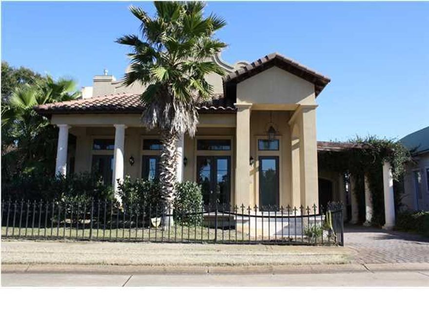 Custom home in the desirable gated Gulf front neighborhood of Caribe! Custom features include travertine and hardwood floors, upgraded carpet in three bedrooms, Venetian plaster walls, granite counters, wood ceilings, deep crown molding and heavy baseboards. First level has entry door plus three sets of French doors across the front and large covered porch, inviting entry foyer, granite topped wet bar in the entry hall, kitchen with granite counters and abundant cabinetry, sunken living/dining room with gas log fireplace, master suite with double sided gas log fireplace, master bath with jetted tub, separate walk-in shower, walk-in closet, additional bedroom and full bath. Second level has two additional bedroom, each with a private bath. Caribe homeowners enjoy two sparkling pools