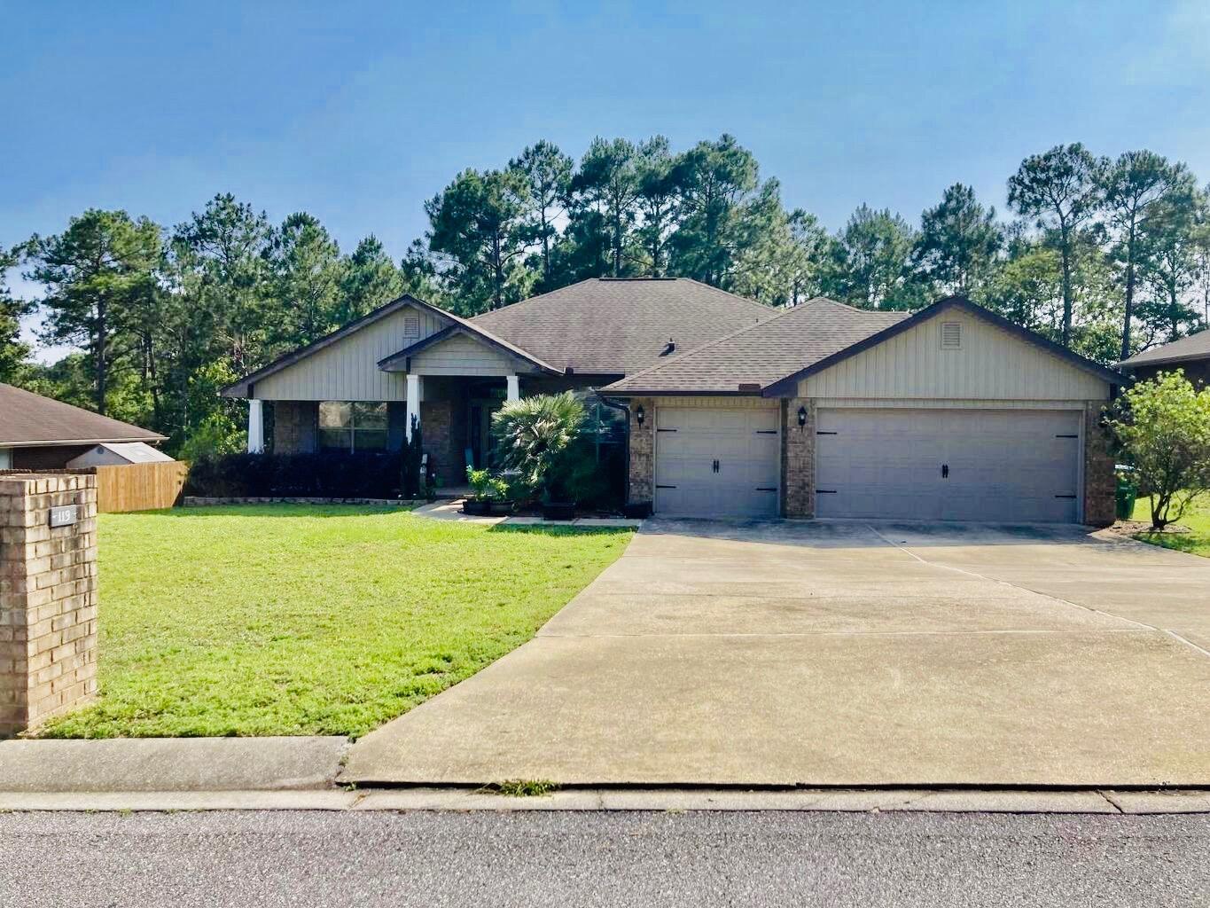 Craving a fresh start in sunny South Crestview? Look no further than 119 Strike Eagle Drive, your gateway to spacious living and endless possibilities. This newer 4-bedroom, 3-bathroom beauty with a 3 car garage isn't just a rental, it's a blank canvas for your Florida dream. Imagine waking up to the soft glow of sunlight filtering through gleaming new floors, leading you to a bright, open living area perfect for family movie nights and laughter-filled gatherings. Each of the 4 generously sized bedrooms offers a peaceful haven after a day of exploring, while 3 sparkling full bathrooms ensure everyone gets ready in style (no more morning mayhem!).Step outside and discover your own private oasis. Grill like a pro on the covered back patio, soak up the sun on the spacious deck, or