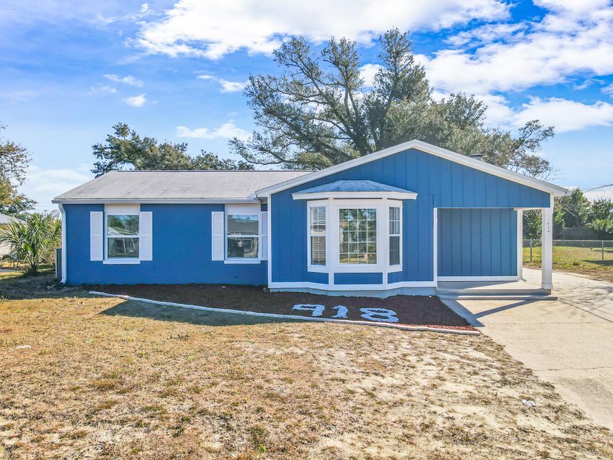 Discover this beautifully remodeled 4-bedroom, 2-bath home in Panama City, just 25 minutes from the beach. It features new stainless steel kitchen appliances, high-quality LVP flooring, a built-in fireplace with shiplap and bookshelves, and a spacious foyer. The master bath has elegant big vein tiling in black and white, with recent upgrades including a new water heater, AC unit, and a 3-year-old roof. The large yard is ideal for parking a camper or boat. Located in the Robindale subdivision, it offers a peaceful neighborhood near Parker Elementary, Rutherford Middle, and Rutherford High School. With no HOA fees, it's vacant and ready for immediate occupancy, blending traditional design with modern elegance for any family.
