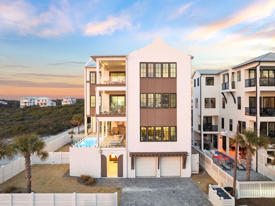 Nestled in an idyllic location overlooking protected dunes with stunning forever Gulf views, 91 Emerald Cove Lane presents an unparalleled opportunity for luxury living. Thoughtfully positioned on a prime corner lot in Inlet Beach, this residence ensures unobstructed vistas of the Gulf from every level, with sweeping views enjoyed from all living spaces. Spanning more than 7,600 square feet across four levels, the home is designed for both grand entertaining and private retreats. A welcoming foyer introduces the main level, featuring a spacious primary suite, a billiard and game room, and a private owner's lockout. The second floor serves as the heart of the home, where expansive living and dining areas flow seamlessly to a resort-style pool terrace. A gourmet kitchen with crisp white cabinetry, a statement island, state-of-the-art appliances, and custom lighting anchors the space, while a full laundry room adds convenience.

Guest accommodations are abundant, including a private guest suite with en-suite bath, a custom bunk room with its own bathroom, and another guest suite overlooking the dunes. A secondary living and game area with shuffleboard completes the third floor. The top level is dedicated to two remarkable primary suites, each capturing panoramic Gulf views with en-suite baths and walk-in closets. One retreat features a spa-inspired bath with a soaking tub perfectly positioned to take in the breathtaking scenery.


With six bedrooms, six and a half baths, covered balconies on every floor, and refined details such as crown molding and wood flooring throughout, this home blends modern luxury with timeless coastal beauty. Just steps from the beach walkover and moments from 30A's best dining, boutique shopping, and entertainment, 91 Emerald Cove Lane defines the pinnacle of Gulf-front living.