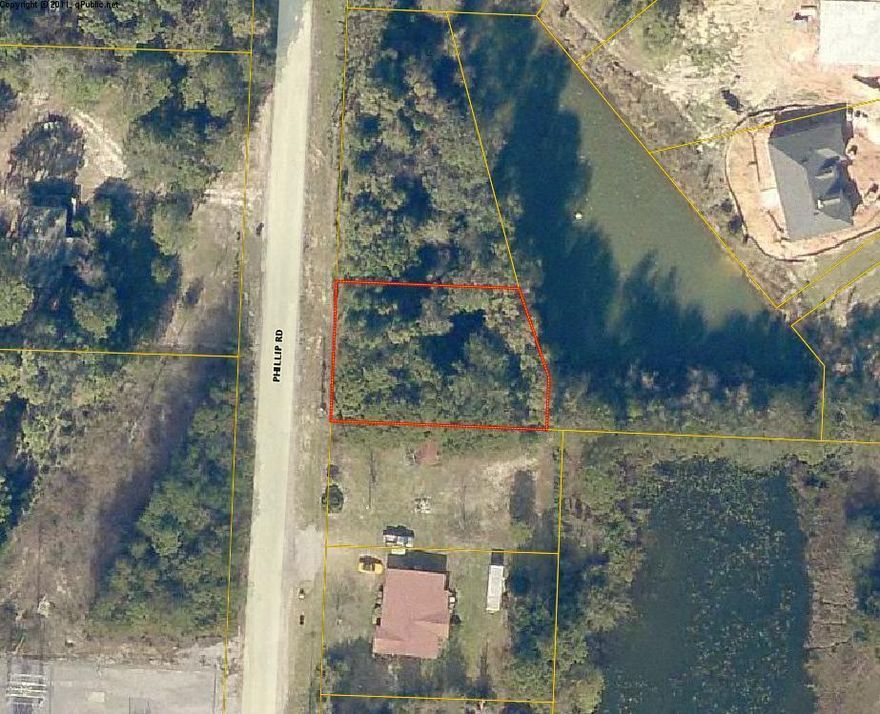 Lot overlooks a small private pond. Great setting for a custom home. Bring your builder. Minimal build of 1400 Sq. Feet set-back 20 feet front, min. 10 Foot. sides & rear