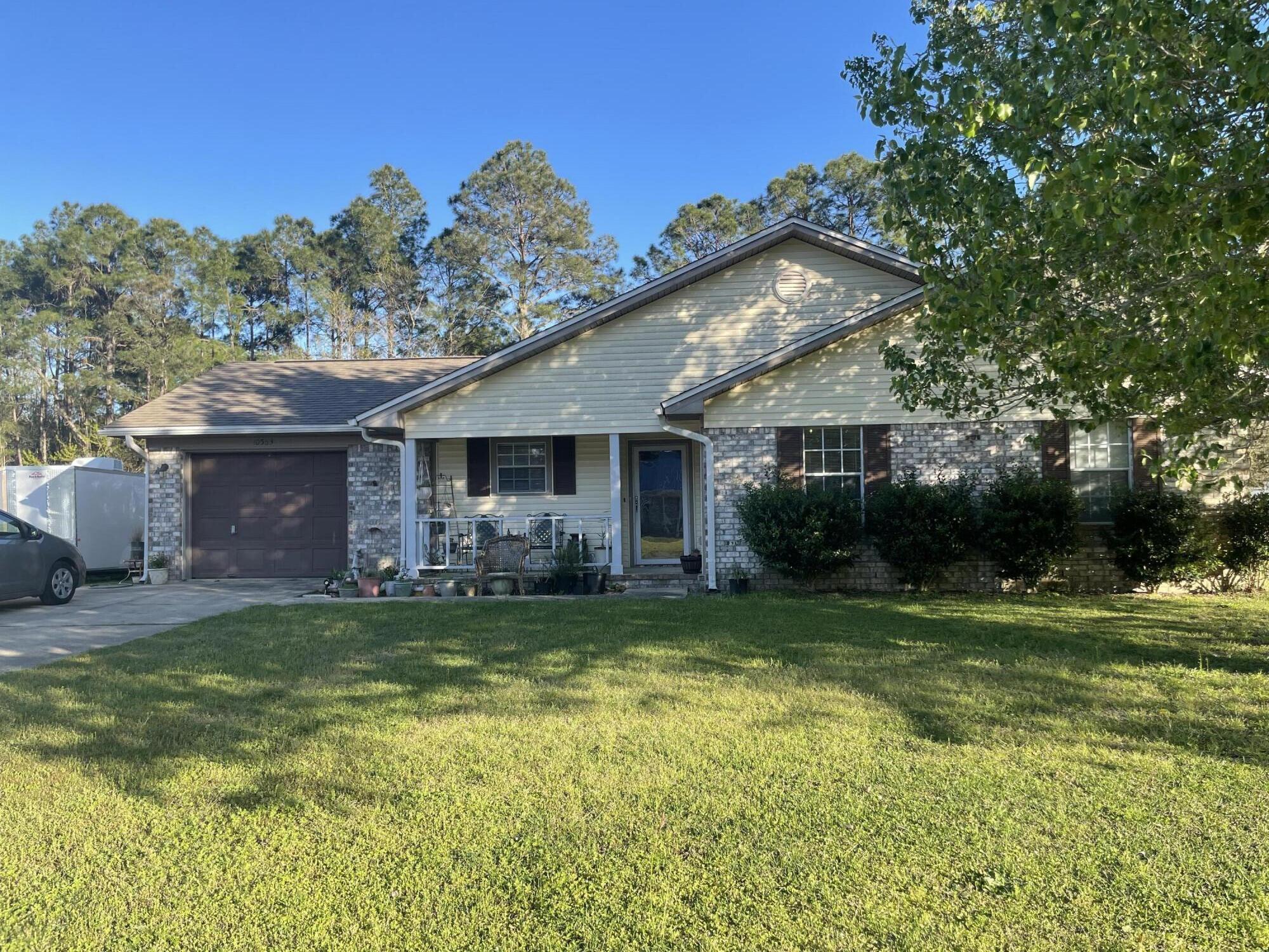 If high UTILITY COSTS get you down, this home is the one for you. Seller is a licensed home inspector and spent years in the SOLAR energy business. Solar panels installed in 2024 have brought the monthly electric bill down to around $15. And the best part is that they are completely paid for! A wood-burning stove insert (with blower) in the fireplace provides even more comfort augmentation during cold snaps. Home is on a huge lot backed by greenspace for privacy, and it has a 25V hookup and paved pad for your RV. Pictures are lacking because the seller is in the process of packing to move to Texas and there are boxes stacked in every room. Come see it for yourself!