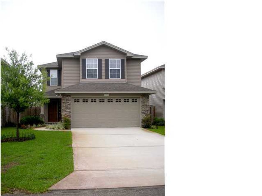 THIS CLASSY HOME HAS EXTERIOR STONE ACCENTS AND A DIMENSIONAL SHINGLED ROOF. ENERGY EFFICIENT & TOTAL ELECTRIC. SPACIOUS LIVING AREA. ATTRACTIVE KITCHEN WITH ALMOST NEW STAINLESS STEEL APPLIANCES INCLUDING DISHWASHER, RANGE & MICROWAVE, PLUS QUALITY MAPLE CABINETS WITH GORGEOUS GRANITE COUNTER TOPS, TRACK LIGHTING, AND A BREAKFAST BAR AND PANTRY. SLIDING GLASS DOORS IN THE DINING ROOM LEAD OUT TO THE PATIO & PRIVACY FENCED BACKYARD. NEW CARPET ALL ROOMS & NEW PAINT THROUGHOUT. THREE FULL BATHS HAVE CULTURED MARBLE LAVATORIES. LARGE MASTER BEDROOM EVEN HAS SITTING AREA. MASTER BATH HAS GARDEN TUB/SHOWER, LOO HIS/HERS WALK-IN CLOSETS. FOUR ADDITIONAL BEDROOMS - ONE IS DOWNSTAIRS, THREE ARE UPSTAIRS. CEILING FANS IN LIVING ROOM & ALL BEDROOMS. 2 CAR FINISHED GARAGE WITH AUTO OPENER.