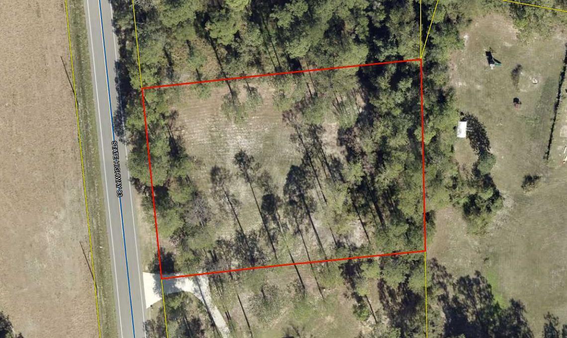 Build a split-level home and live 30 minutes from the beaches. You could build your garage under the house and house would be level with the highway. There is a shared driveway.