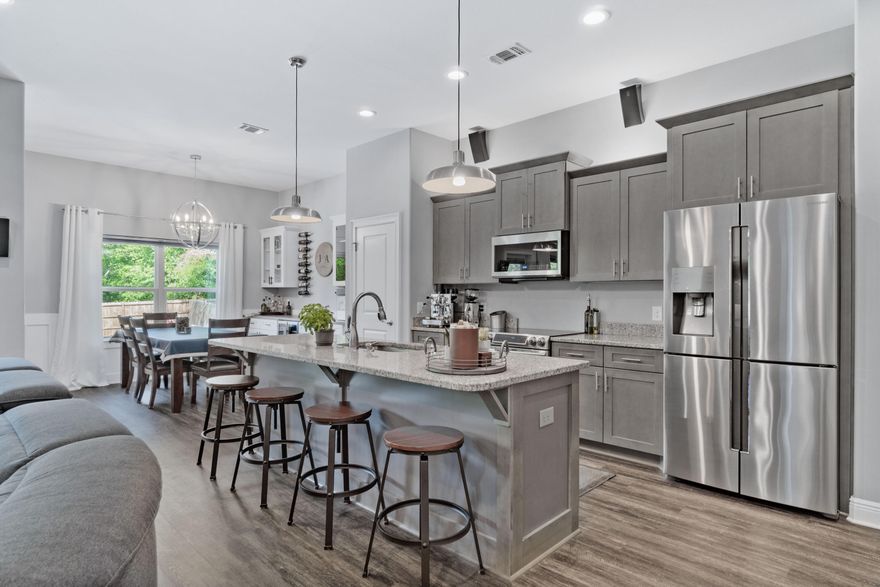 CRAFTSMAN Custom Built Home in EAST NAVARRE ~ this GORGEOUS  4 bed/2 bath floor plan is exquisite inside and out ~Great Location with easy access to Navarre Beach, Navarre Waterfront Park and Hwy 98 to Hurlburt Field AFB.This Stunning Robbins Builders Custom Home offers trend setting Features~Only 3 years young and with all the additional features taken care of for you to just move in and enjoy ~ current homeowners have made this home absolutely stunning with additions of style and detail to be desired ~You will appreciate the manicured landscaping and delightful front sitting porch ~On entering the home you will be greeted by a walk in foyer sweeping through to your open floor plan~ kitchen with custom cabinets~ crown molding, beautiful GRANITE .... counter tops with crown molding ~Under mount sink~S/S upgraded Samsung appliances ~ Gorgeous addition of the " butlers " area off the dining area with additional cabinets beautiful walnut butcherblock top and glass display cabinets enhanced by wall wine display & sleek wainscoting ~slick top Center Island with Breakfast bar & open flow to the large family room, Wood laminate through the foyer & main living area with tiled laundry and bathrooms. Master with trey ceiling, ceiling fans & Shiplap accent wall ~ Master bath offers an oversized walk in TILED shower ~ Granite double vanity
separated by a linen closet ~ His & Hers walk in closets with IKEA pax closet system ~Brushed Nickel fittings with picture framed mirrors & Separate W.C .Additional Bedrooms are a great size with double closets and ceiling fans ~ Office/bedroom off the main family room makes for great additional space with custom accent wall and two closets with an adorable window seat in between .Home has a welcoming covered front porch and large covered back porch to sit out and enjoy those wonderful Florida evenings great to cook out and entertain ~ Step down to your large lot offering a fully reinforced fenced family yard with extended patio area enjoying a stone fire pit and plenty of room for a future pool ~ wooded buffer for privacy .Double garage offers a long driveway with extended boat pad parking -15 x 30 .TAEXX in wall pest control system~ Hurricane protection boards and dimensional shingle roof for lower insurance premium. Upgrades throughout include bullnose corners, knockdown ceilings, gutters~ Solar Panels ~ Generator plug~recessed lighting, deluxe lighting package,50 Gallon water heater, garage door remotes, attic drop down stairs~ to name a few..........Call today to view this wonderful family move in ready home.
