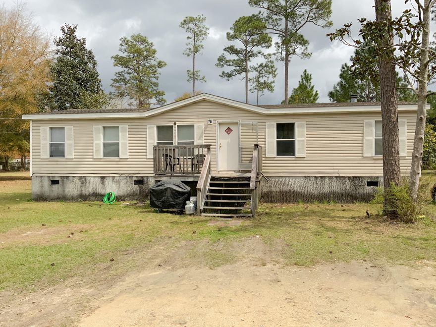 Sitting on just over 1/2 an acre this home offers a large master suite with walk in closet and 2 living spaces. One of the living spaces opens up to the eat in kitchen, perfect for entertaining! Many updates that include a new roof in 2016 as well as new laminate wood floors in the bathrooms and kitchen, new carpet in the bedrooms and living areas. A new 200amp 6 circuit panel, and new a/c ducts under home.