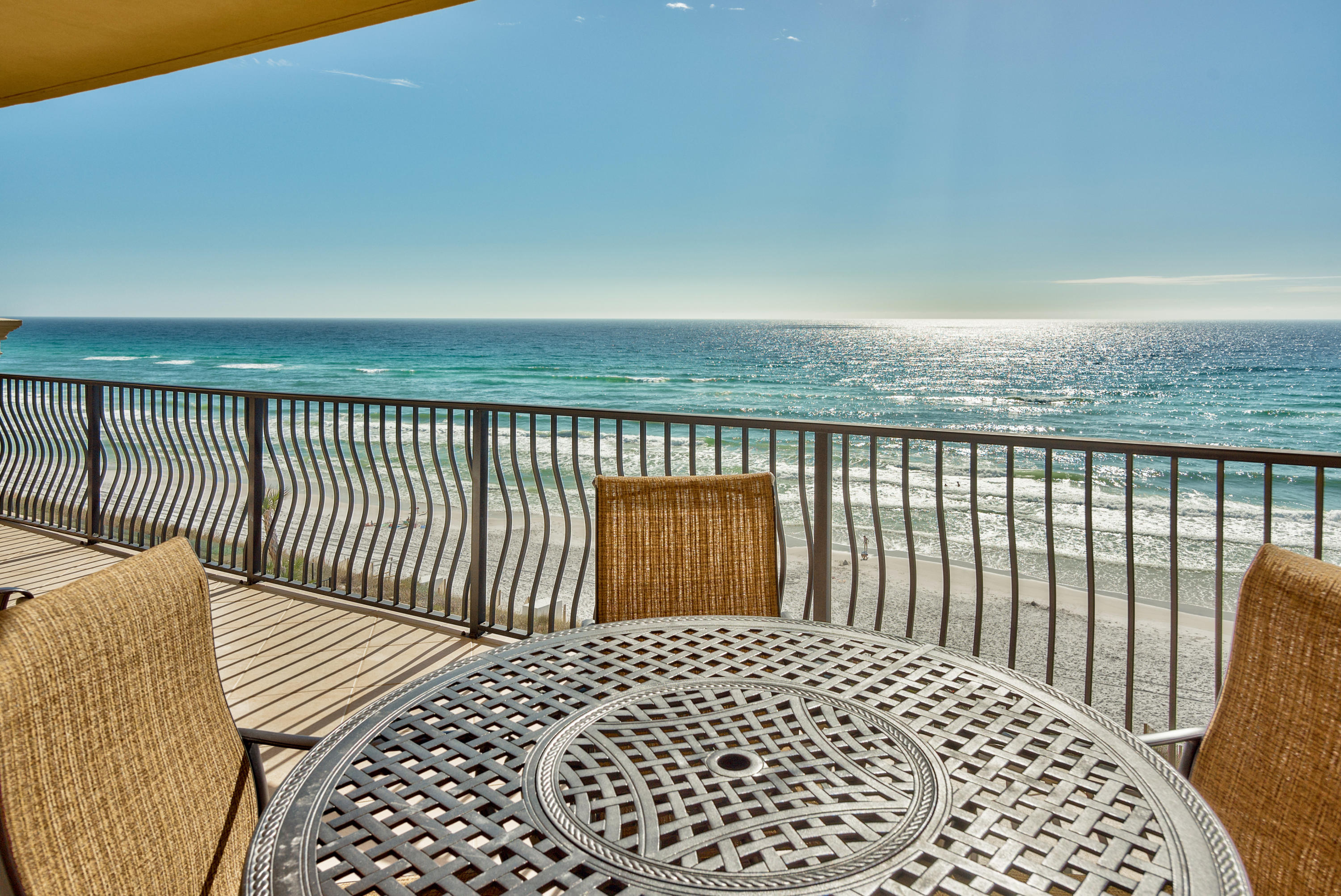 Seize this unique opportunity to move into a top floor corner condo in the coveted C-building at Adagio in Blue Mountain Beach. Beyond the dunes, panoramic views take in the glittering white sand and emerald gulf waters. Enjoy morning coffee or breakfast out on the deep balcony watching pelicans glide over the gently turning waves. It's like sailing gently along on your own private yacht or cruise ship. Understandably, this beautifully appointed four bedroom unit has generated outstanding rental income for past owners. Relax in the well-proportioned living room and appreciate the gas log fire as a focal feature while admiring the unsurpassed sea views. The condo is tastefully decorated with a palette of muted tones complemented by crown molding.