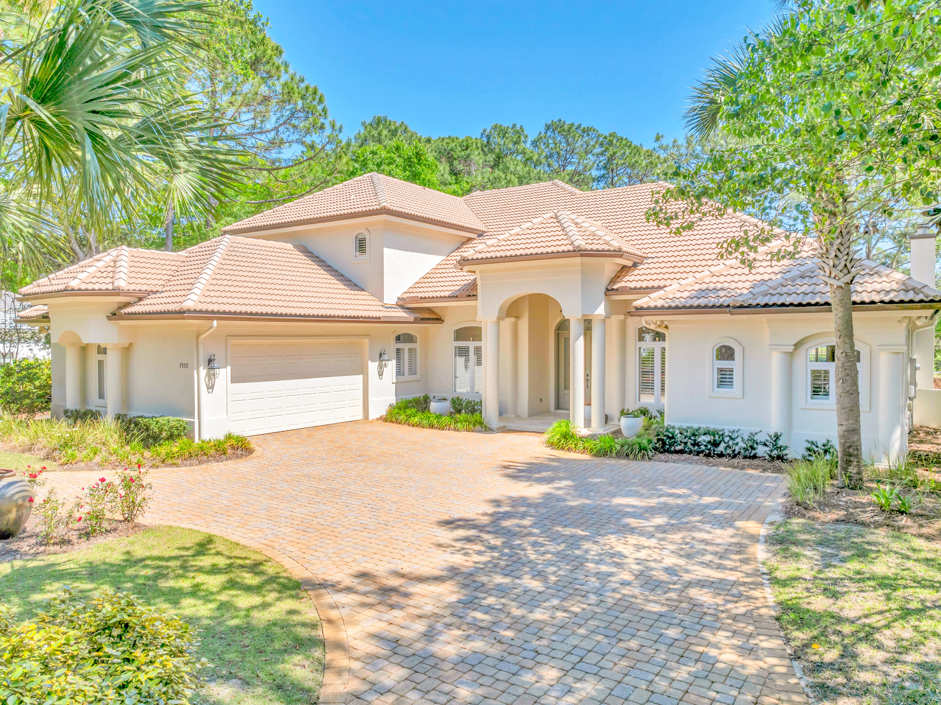 Elegantly reimagined with high-end finishes and expansive indoor-outdoor living, this exquisite Island Green residence offers a rare opportunity within one of Sandestin Golf and Beach Resort's most exclusive enclaves. Poised on a quiet cul-de-sac with sweeping views of the Raven Golf Course and a tranquil lake beyond, the home captures a sense of privacy and refinement at every turn.The stately interior features wood and limestone flooring, soaring 20-foot ceilings, and an abundance of natural light from walls of glass that frame the lush fairway backdrop. The designer kitchen is a chef's dream with quartz countertops, 48-in. Sub-Zero paneled refrigerator, Miele gas cooktop, apron-front sink, and custom tilework. A spacious living room with a fireplace flows into the formal dining.... area, breakfast nook, and a cozy family room with a wet bar, making entertaining both effortless and elegant.

The first-floor primary suite serves as a private retreat with a fireplace, sitting area, dual walk-in closets, and a spa-worthy bath wrapped in limestone and glass tile. A dedicated office, an additional guest suite, and an oversized laundry room complete the main level. Upstairs, two bedrooms and a loft-style lounge provide space and flexibility for guests or multigenerational living.

Outdoors, a retractable screened lanai opens to the beautifully landscaped backyard with a grill, waterfall hot tub, and pool. Additional highlights include a three-car garage, golf cart garage door, and recent upgrades to A/C systems and landscaping. Tucked inside a gated community with access to Sandestin's premier resort amenitiesgolf, tennis, biking paths, marina, and morethis refined estate is the pinnacle of resort living.
