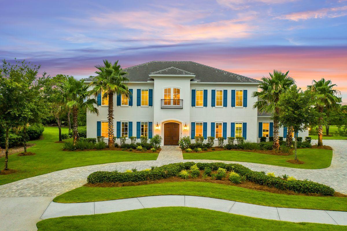 Stately country French manor positioned within the gated privacy of Kelly Plantation describes this home built by Magnolia Custom Homes in 2016. Positioned on a premier lot with 240 feet of lakefront bordering the golf course with expansive views of greenery. A white stucco exterior accented by Sojourn Blue shutters frame this estate like property. Designer-influenced staging highlights the lifestyle of the 5,332 square foot home, complete with six bedrooms, four-and-a-half baths, and an oversized lot with a covered outdoor entertainment area flowing to a 40X18 pool. Notable features include a grand curved staircase, abundant square footage with 12-ft.ceilings, crown molding, chef's kitchen,