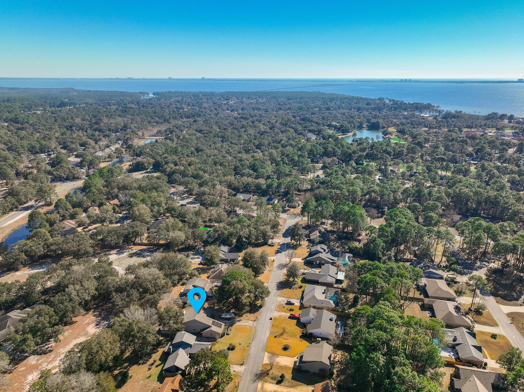2.98% VA ASSUMABLE LOAN!! Fantastic, spacious Home W/3 YR ROOF & 2 large living areas in BWB just minutes to Destin. Flooded w/natural light, the dramatic, large living rm w/18+ ft wood ceiling & soaring, whitewashed stone, wood burning fireplace takes center stage & will be the gathering place for all. The 2nd, 627 SF Great rm w/beautiful custom wood ceiling & French doors provides the ideal space for relaxation, play & family movie nights. You'll love the renovated eat-in kitchen w/newer cabinets, granite counters, SS appl & large eating bar. Dine casually in the breakfast nook or entertain in style from the formal dining area. Fresh interior paint, NEW interior doors throughout & NEW LVP flooring on stairs & 2nd level provide an updated look. Enjoy privacy in your master retreat/updated master bath, large walk-in closet & hidden" pocket office area in back of master closet. The 2nd level loft makes an ideal office or exercise area. 3 Year roof & 7 Yr HWH provide affordable insurance, and newer solar panels (to be paid off in full at closing) provide lower utility bills. The spacious backyard w/patio & natural views allows plenty of room for play and/or pool. Located in the heart of Bluewater Bay's resort community, schools, shopping & restaurants are close by. Hop onto the Mid-Bay Bridge and arrive in minutes to the white sand beaches of Destin. Enjoy an easy commute to Eglin, Hurlburt or Duke Field. Act now as this Home won't last long.