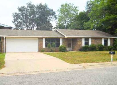 Perfect starter home or investment property in South Crestview, Come see this charming 3-bedroom, 2-bathroom home with a 2 car garage and large level fenced yard. This home has a lot of potential and with a few updates could easily become your perfect home or even flipped for profit. For many years it was a profitable rental investment. The spacious family room has a fireplace and sliding glass doors that open to back yard. Ceramic tile flooring throughout. You won't find a home that is more south on Hwy 85 making commuting to military bases is a breeze. Home is being sold 'As IS' condition