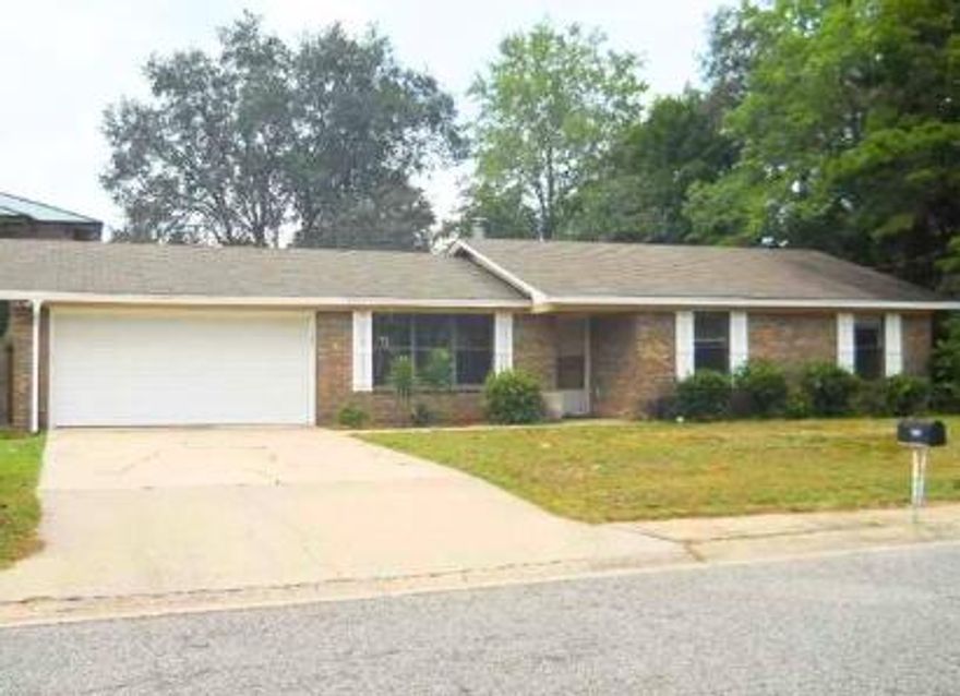 Perfect starter home or investment property in South Crestview, Come see this charming 3-bedroom, 2-bathroom home with a 2 car garage and large level fenced yard. This home has a lot of potential and with a few updates could easily become  your perfect home or even flipped for profit.  For many years it was a profitable rental investment. The spacious family room has a fireplace and sliding glass doors that open to back yard. Ceramic tile flooring throughout. You won't find a home that is more south on Hwy 85 making commuting to military bases is a breeze.  Home is being sold 'As IS' condition