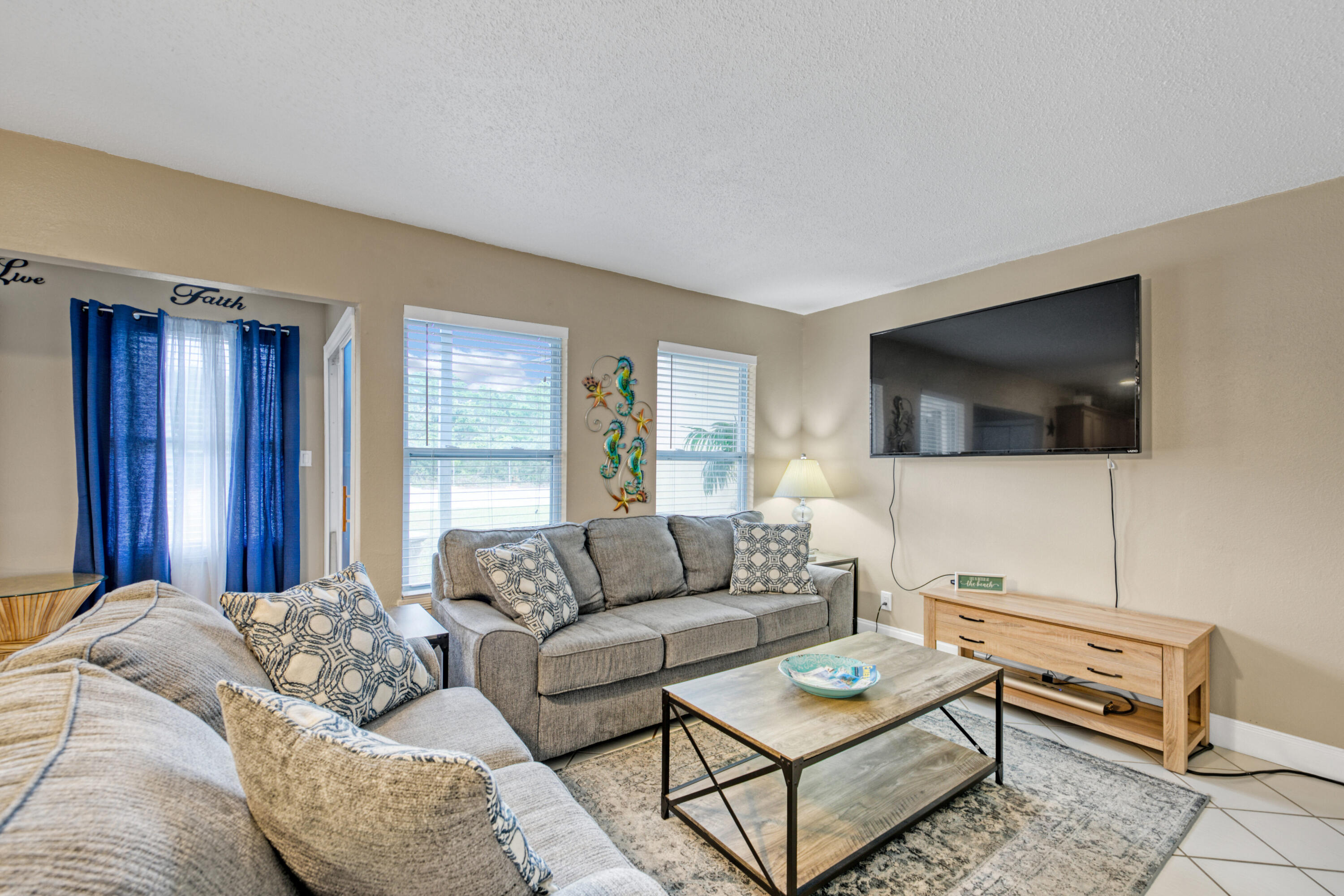 Don't miss your chance to own a slice of paradise. This gorgeous 2 bedroom 1 bath unit has been updated throughout. It comes fully furnished with full size washer and dryer. Move-in ready and would make an excellent vacation rental or primary residence. It's grossed over $22K from March to October in its first year on the rental program and it has the potential to be a real rental income machine for investors. The complex features two gated entries, three pools, two tennis courts and it is a short distance to the beach. The A/C was installed in 2020 and many updates are being made around the complex including new exterior paint and a new fence. HOA fees include: TV/Internet, Water, Sewer, Trash, and Common Areas. Buyer is verify all dimensions and square footage.