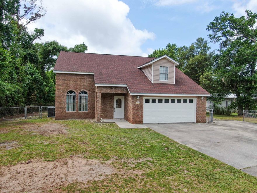 Do yourself a favor and look at this 4 bedroom and 2.5 bath home located on almost half an acre with water access to Deer Point Lake in back of the property. The house features a loft upstairs along with the 3 additional bedrooms with the Master Bedroom located on the first floor. The vaulted ceilings give this home an open feeling and the owner just gave the home a fresh coat of paint in the living areas of the home along with new light fixtures and ceiling fans. Central AC unit is less than 2 years old and is still under warranty. Out back, you have a 20x30 climate controlled workshop and another outbuilding that has a tankless water heater. Roof was replaced in December of 2018 and the dock by the canal which is navigable to Deer Point Lake and Econfina Creek is less than 2 years old