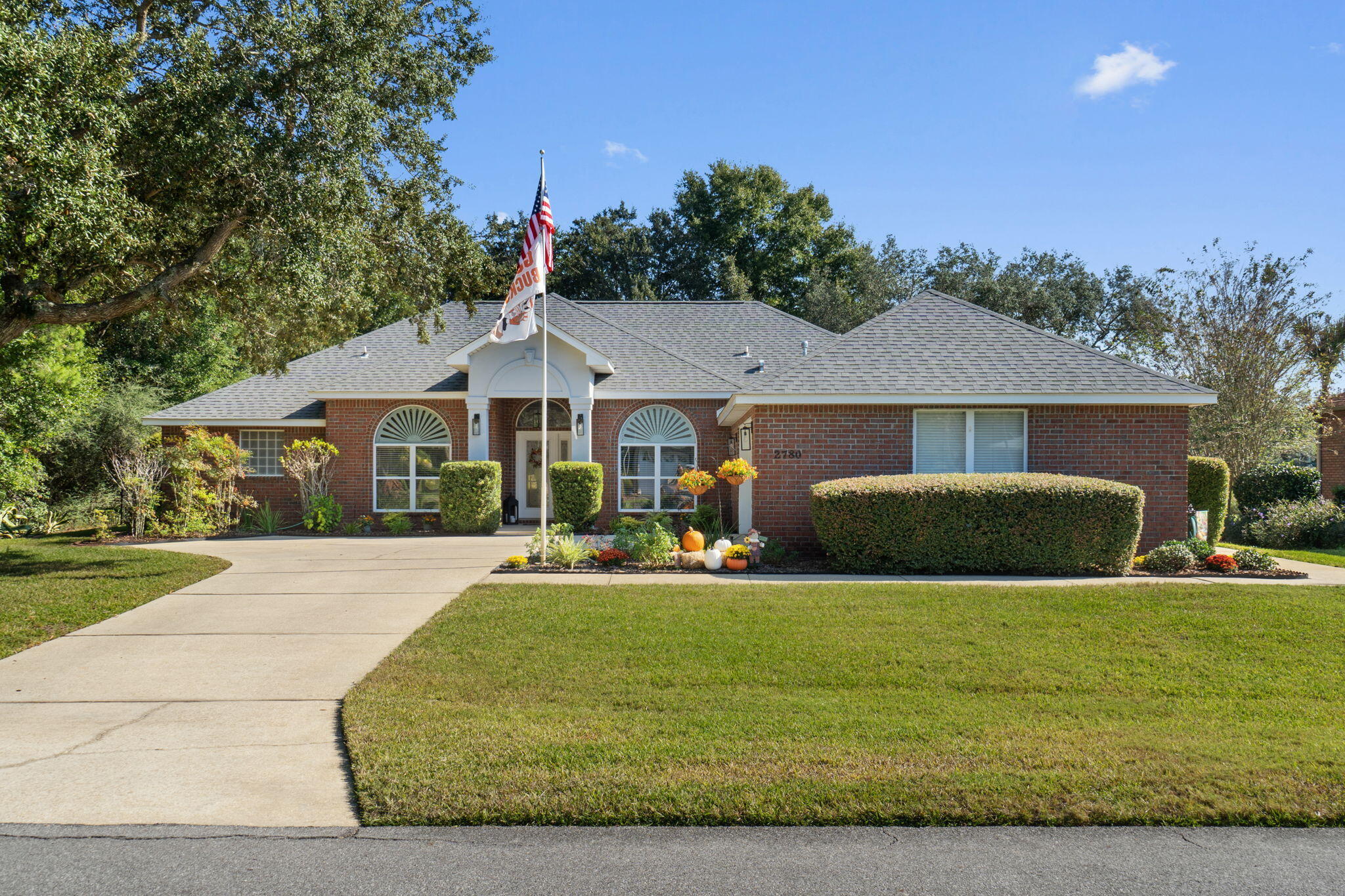 WELCOME HOME to Florida living at its best...This stunning custom built 4 bed / 3 full bath POOL home is exquisite inside & out ~ Nestled in the sought after Hidden Creek Estates Golf Community of Holley by the Sea enjoying all the Club House amenities including: Pools, Fully Equipped Gym, Tennis Courts, Waterfront Park & Deeded Access to Santa Rosa Sound Offering 2582sq. ft. of living space and a new roof in 2020, this home is both elegant and practical. The landscaped front garden features manicured borders & mature trees~ Relax in your fully fenced back yard with large screened in-ground pool to cook out and soak up those wonderful Florida evenings. This true custom-built home greets you with a sweeping columned porch~ Throughout  the home, you'll find luxury vinyl plank and charming plantation shutters .The entry foyer flows through to the greeting room where  high ceilings and natural light enhance the open and airy atmosphere  ~ family room enjoys a private setting between the breakfast nook & kitchen and offers French door access to the back porch .Wonderful gourmet kitchen featuring glazed wood cabinets, Corian countertops, large corner pantry~ S/S appliances, microwave ,undermount sink  & sleek glass top stove . Center island has additional cabinet space & wrap around hop up breakfast bar to the family room. Formal Dining room can accommodate a large table and still has an open feel to the rest of the home ~perfect for entertaining. Front office / 4th bedroom with a glass door and built ins makes the room multi-functional. Master suite is spacious with trey ceiling & French door out to the pool. Luxurious spa inspired bathroom has been beautifully remodeled enjoy a large, tiled shower with sitting bench, rain head shower and body jets. Separate custom vanities and linen closet. Master suite bathroom has plenty of dressing area with barn doors to his and her closets fitted with custom built shelving. This split floor plan home has great sized additional bedrooms with double closets & share a Jack and Jill bathroom offering a cultured marble vanity, separate WC and tub/shower. Back Yard has a decorative fence and grassed area with mature greenery and trees for privacy to provide a wonderful evening entertainment area. You will appreciate the attention to detail throughout this custom-built home with high ceilings, deep base boards, recessed lighting~ large laundry with additional cabinets. Courtyard entry accesses the 2 car garage with the golf cart garage having its own garage door out to the side of the home, Garage also offers storage racks, EV charger with separate circuit box for electric vehicle , New Gas Water heater and side exit door with wrap around pathway are to name a few of the additional features you will enjoy ~
Holley By The Sea is ideal for the local shops and in easy access of the Navarre Beach Bridge across to the beautiful white sandy beaches of the Gulf of Mexico. Navarre is situated between Pensacola and Destin and Hwy 87 provides a direct route to the I-10 . Drone pictures attached to experience the true value of this location... Call today to arrange a private viewing.


