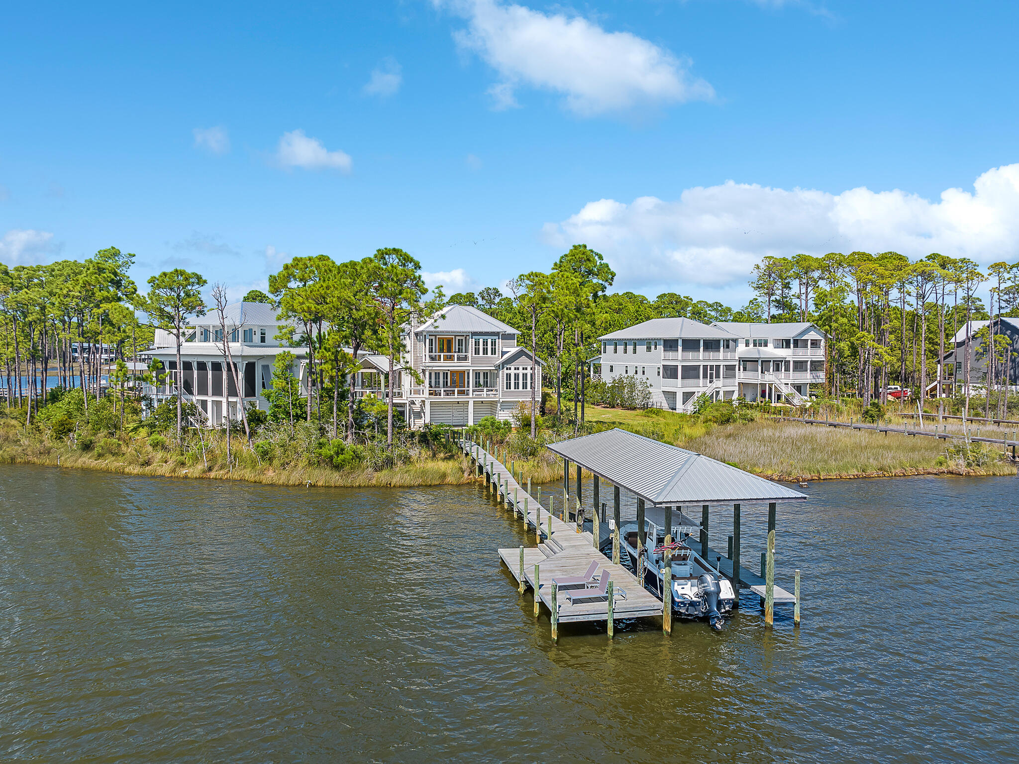 Exquisitely furnished, turn key opportunity! Welcome to Sunset Point at 55 Teal Ct, a rare south & west facing bayfront property w/ breathtaking views of Choctawatchee Bay. The positioning of this custom-built home by Grand Bay Construction is designed to maximize unobstructed sunset vistas over converging marshes, pine trees, & wetlands. Every aspect of Sunset Point was thoughtfully planned. Custom finishes include reclaimed wood beams, white oak hardwood floors, Venetian plaster fireplace & smart home features like mesh wireless network & a Marantz multi-zone whole home stereo system, & more. The professionally decorated interior boasts large living spaces with expansive windows, custom window treatments & high end furnishings. THIS PROPERTY IS BEING OFFERED FOR SALE, FULLY FURNISHED.