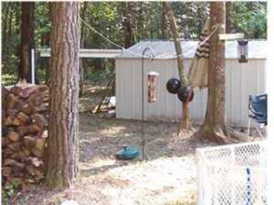 Half acre of prime real estate - great location - HUGE potential. paved road access. secluded - quiet location - but just minutes to everything! value is given to the land