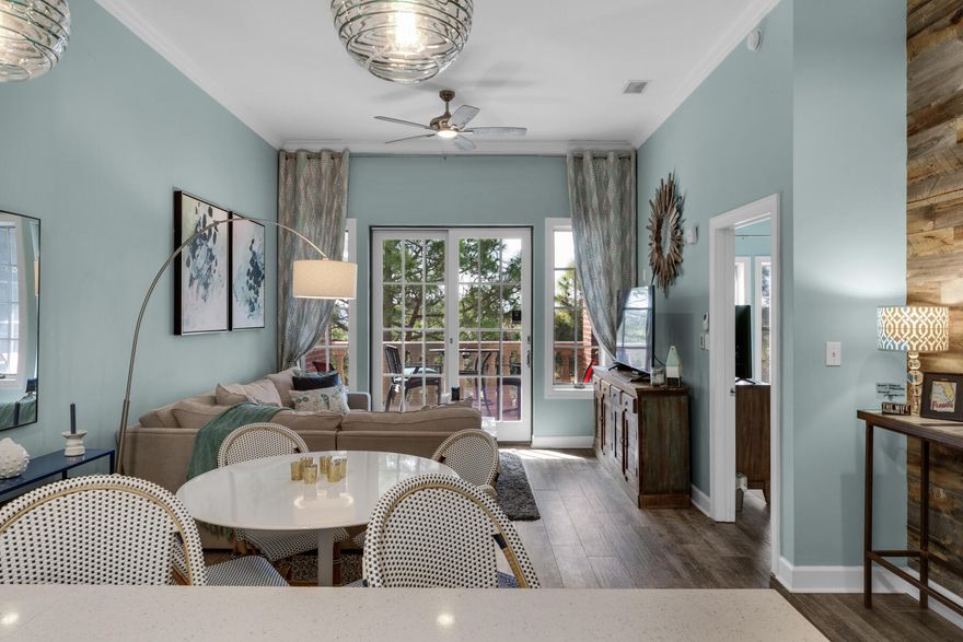 Unit 308, ''The Magnolia,'' located in the upscale community of The Village of South Walton directly on 30A--nestled between Rosemary Beach and Alys Beach, in Seacrest Beach--is the essence of 30A living. The Village hosts restaurants and shops downstairs, with more attractions a short walk both ways down 30A, and at 30Avenue on Route 98. This is a serene, well-appointed unit, and owners have paid attention to every detail of this premier top-floor (third floor) condominium, with multiple improvements as recent as 2021-22, including new AC unit with Nest thermostat and remodeled kitchen. The condo is open and airy with 11-foot ceilings and ceramic wood-look tile throughout the unit. Crown molding highlights the high ceilings in the hallway, living area, and master suite. The remodeled kitchen refreshed cabinets, and opens to the dining and living areas. Elevating the comfort and coziness of the living area is a wood wall in the family room alcove. The family room opens to the private balcony, where one can enjoy people-watching, evening sunsets, music and activities on 30A. The master suite is spacious with a master bath with double vanities, jetted tub with chandelier lighting, walk-in shower, two owner closets, and a closet for rental guests. A private door leads to the balcony from the master suite.Off the front hallway are two guest bedrooms, one with a queen bed, and the other with large bunks. The guest bath was updated in 2022 with new vanity, wood wall, and lighting.  The Village community amenities include gated pool and splash pad, grill and picnic area, deeded beach access, elevators, and tram service March through October. The HOA replaced the roof in 2018-19.Enjoy the beaches of South Walton and experience eclectic 30A communities with restaurants, shopping, and biking, or visit the national parks, rare coastal dune lakes, and annual events all along 30A. This unit is perfect for home ownership or a vacation/rental.  A list of improvements is available. Buyer to verify all dimensions and homeowner dues.
