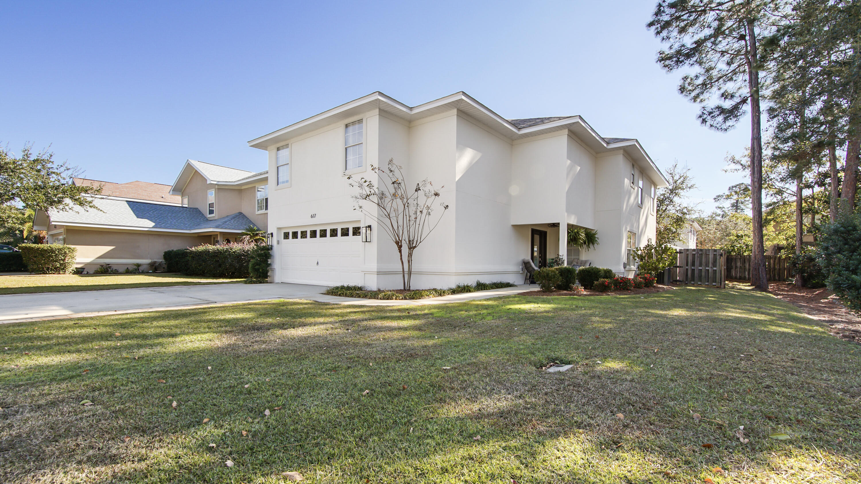 This beautifully updated 2,349-square-foot home is nestled in the highly desirable Driftwood Estates neighborhood, offering a peaceful setting with a private, HOA-maintained common area adjacent to the property. Featuring 4 spacious bedrooms, each with massive closets, this home is designed for both comfort and style. A meticulously landscaped, fenced-in backyard boasts a sparkling Pebble Sheen-finished pool, a spillover hot tub, and a pavered patio, perfect for entertaining or relaxing in your own private oasis.Step onto the cozy, private front porch overlooking the HOA-maintained green space and feel instantly at home. Inside, fresh paint throughout complements the thoughtful touches added by a family who has truly loved this home.  The open-concept kitchen and living area is perfect for gatherings, with stainless steel appliances, granite countertops, ample cabinetry, and large windows that fill the space with natural light. Expansive 14-foot ceilings, a warm fireplace, and beachy-grey ceramic tile floors create an inviting coastal ambiance. A versatile main-level bedroom can serve as a home office or study.

The staircase, upgraded with brand-new Cali vinyl wood flooring, leads to the upper level, where a well-designed split floor plan offers privacy. The master suite is a tranquil retreat, featuring tray ceilings, an en-suite bath with double vanities, a luxurious soaking tub, a brand-new glass shower, and a spacious walk-in closet. The additional guest bedrooms are generously sized and full of potential for family or visitors.

This home is truly turn-key, offering a host of modern updates, including a high-efficiency AC unit with a Wi-Fi-enabled "smart" thermostat, updated light fixtures throughout, and a brand-new roof installed in 2023, ensuring peace of mind for years to come. Fresh speckled epoxy coating and additional storage added to the garage in 2024. 

Driftwood Estates is renowned for its exceptional amenities, including an 11-acre community park that features a community room, basketball courts, grills, multi-purpose fields, tennis courts, picnic pavilions, a playground, restrooms, and scenic walking trails. The neighborhood pool offers even more opportunities for fun and relaxation.

Conveniently located near the Choctawhatchee Bay, Sacred Heart Hospital, and the upscale shopping and dining at Grand Boulevard, this home is just minutes from the pristine white-sand beaches of the Gulf of Mexico, as well as the vibrant destinations of 30A, Destin, and Panama City Beach.

A recent survey is available, saving buyers money at closing. With its ideal location, extensive updates, and move-in-ready appeal, this home offers a perfect blend of comfort, style, and convenience. It's more than just a houseit's a place to create memories. Schedule your private showing today before it's gone. All information and measurements are deemed accurate but should be verified by the buyer.