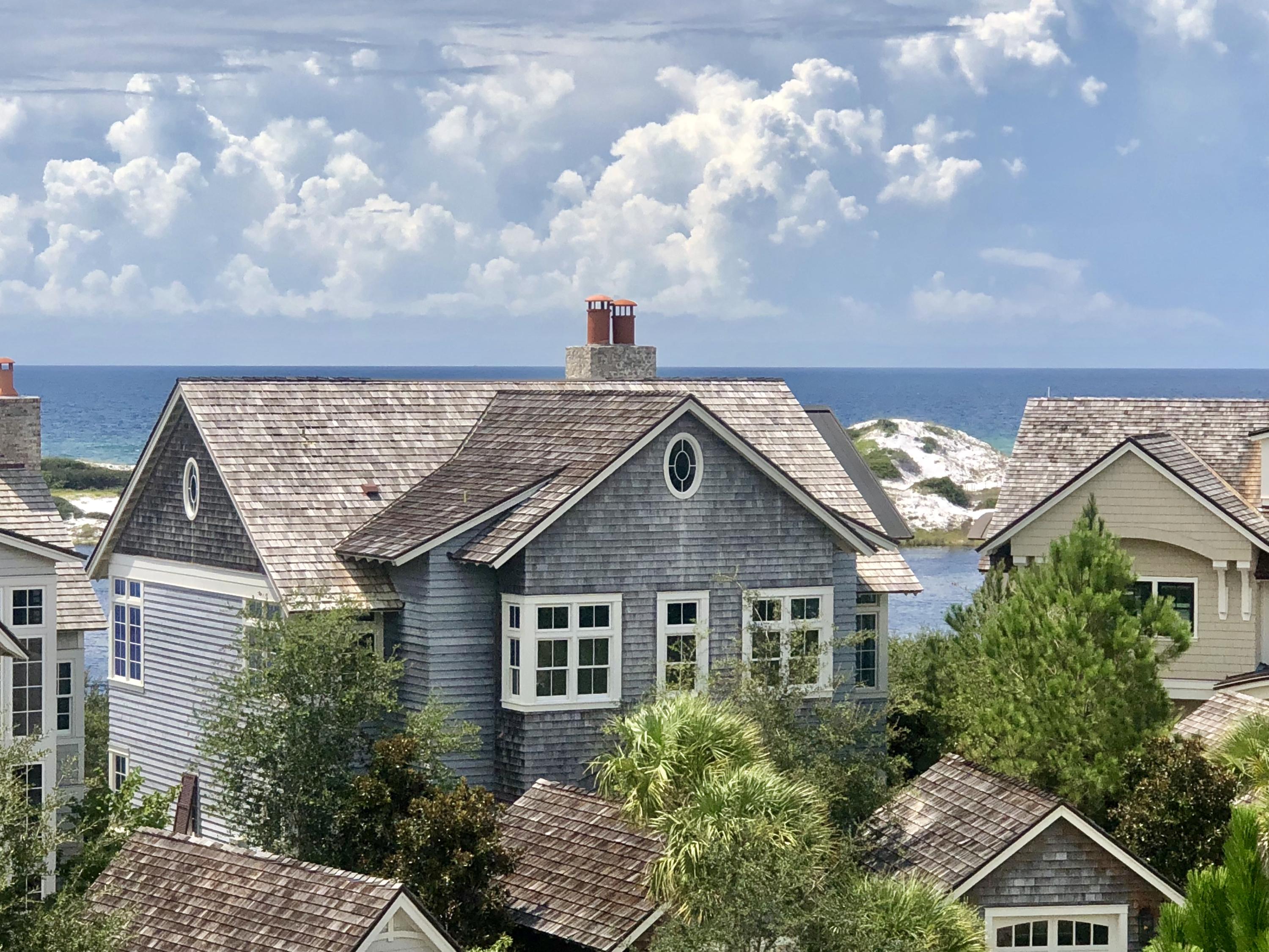 A rare opportunity in Watersound Beach. There are amazing panoramic views of both the Gulf of Mexico & a Coastal Dune Lake. A winning design by Thurber Architecture & built by Rice Construction and backs up to a green buffer space.Located just steps from the beach it exudes coastal elegance at its finest in a very private setting. The professionally decorated interiors encompass extraordinary finishes & attention to detail. On the first floor one will be impressed with the size and proportion of the three guest suites & corresponding ensuite baths. One of the bedrooms is a master which includes a master bath with elaborate marble & tile. Ascend the stairway and find an abundance of natural light.The walk to a Coastal Dune lake and beach is across the street and is very private.