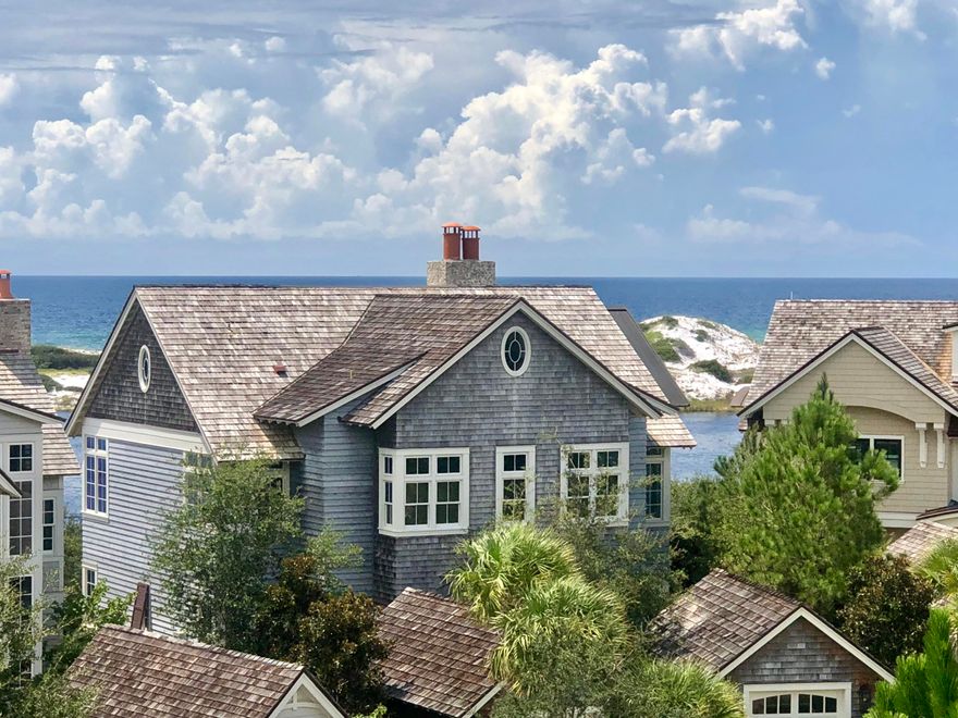 A rare opportunity in Watersound Beach. There are amazing panoramic views of both the Gulf of Mexico & a Coastal Dune Lake. A winning design by Thurber Architecture & built by Rice Construction and backs up to a green buffer space.Located just steps from the beach it exudes coastal elegance at its finest in a very private setting. The professionally decorated interiors encompass extraordinary finishes & attention to detail. On the first floor one will be impressed with the size and proportion of the three guest suites & corresponding ensuite baths. One of the bedrooms is a master which includes a master bath with elaborate marble & tile. Ascend the stairway and find an abundance of natural light.The walk to a Coastal Dune lake and beach is across the street and is very private.