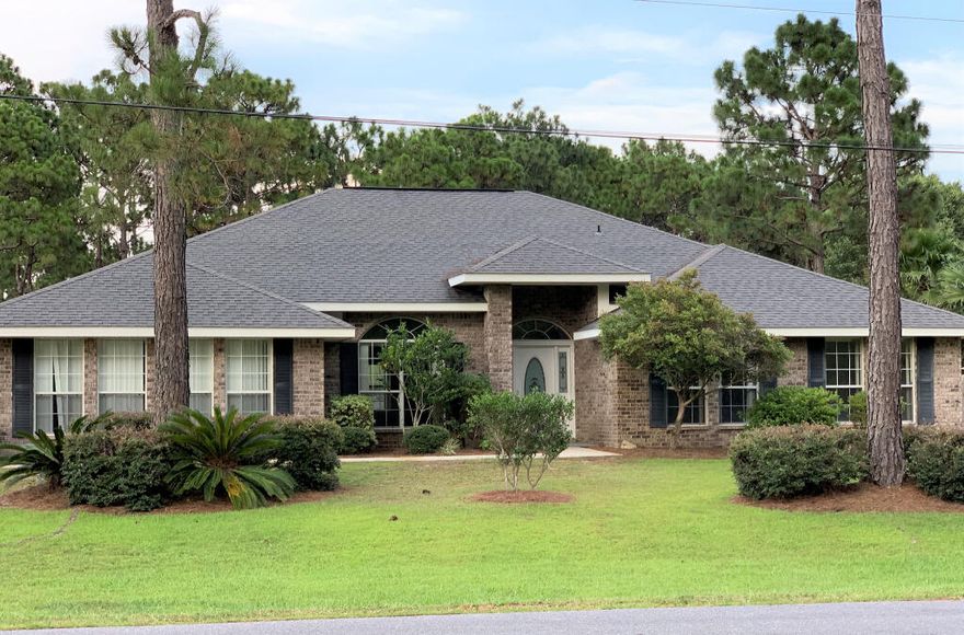 4BR/3FBA/2CG.  All Brick Home. 3,000 Sqft.  Located on a corner lot in a cul-de-sac with beautiful landscaping.  5min drive to Navarre Beach.  Large fenced HUGE backyard great for RV storage.  Lots of storage in attic.  Large rooms & open floor plan with Dream Kitchen that features Italian ceramic tile counter tops and back splash.  Ceramic tile throughout Great Room and bathrooms.  Master suite features beautiful trey ceiling, double vanities, garden tub with block window above, separate shower &  double walk-in-closets.  House is wired for security monitoring and Cable/DirectTV ready.  School bus stop in front of home.  Sprinkler system runs off Well Pump & Timer.  Public sewer and water.  Electric Range, Microwave, Dish washer, Refrigerator, Garbage disposal.