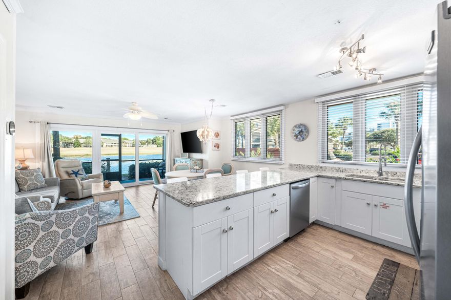 YOUR GULF AREA OASIS AWAITS! GREAT RENTAL HISTORY! Enjoy  your private, screened-in balcony or patio (this condo has both), while enjoying the lake and golf course view. This meticulously maintained 3 bedroom rare coastal gem is an end unit that provides additional privacy and more natural light with side windows, and is also is just steps away from the famous Emerald Coast water and  white sugar sand.  Seascape Resort is a sought after choice, where you will enjoy 5 available pools, pickleball, tennis, golf, playground, basketball court, picnic area, dedicated beach area & on-site restaurants. The pool nearest to this location is even heated! The kitchen features a beautiful granite counter top. 1 bedroom is downstairs and 2 upstairs. New Roof, HVAC, windows & Hardie Board siding.