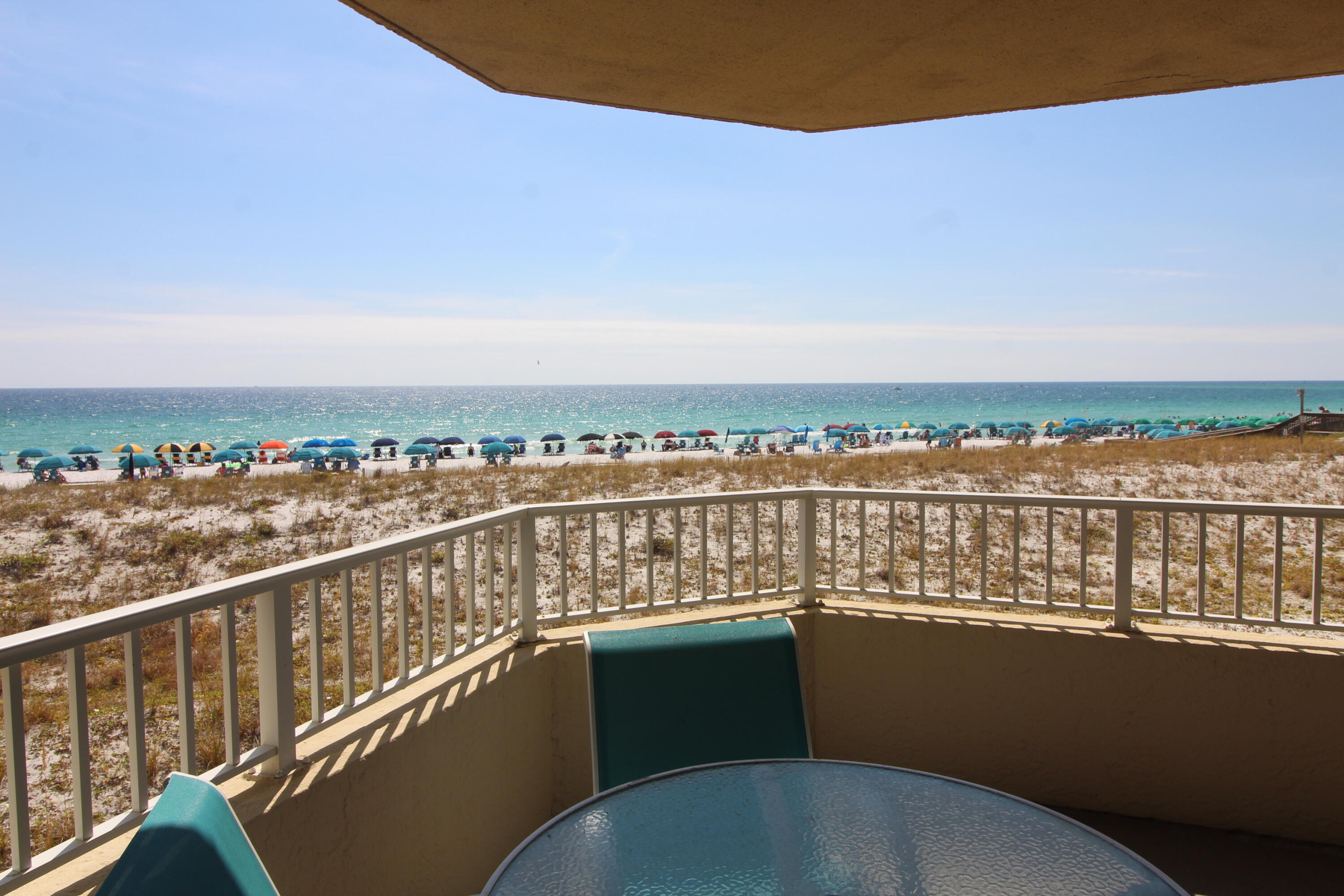Opporutunity to own a beachfront unit that rarely comes on the market. Unit 105 is a 2/2 offering 1362 Sq. Ft. with fabulous views from the kitchen, dining and living area as well as from the master bedroom. This unit has not been rented but would make a geat investment opportunity for the right person or a second home for those who do not wish to rent. You can easily convert this unit to a 3 bedroom. Great amenities include a seasonally heated pool, whirlpool,cabana, BBQ grills, community room, shuffleboard, lighted Tennis/Pickal Ball Courts(under construction) Covered Parking, Gated Community with Security. Owners only are provided with 2 great open areas with dog stations for furry friends!