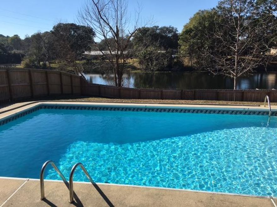 LAKE FRONT WITH A POOL. Home has a nature lovers back yard. Swimming and kayaking in your back yard This home has been totally redone. When you enter your foyer, to your left is your office or play room. Formal dining is to your right. Family room with a tile fireplace is straight ahead. French doors that look out over the pool and the lake lets so much natural light inside. The kitchen, family room and formal dining are all open. The kitchen has new cabinets, tile counter tops. The master bedroom is to the right of the kitchen. This room also has French doors that leads out to the deck. The master bathroom has a 23 jet whirlpool tub and a separate shower. Split bedrooms. 2 bedrooms and bath are located on the other side of the home