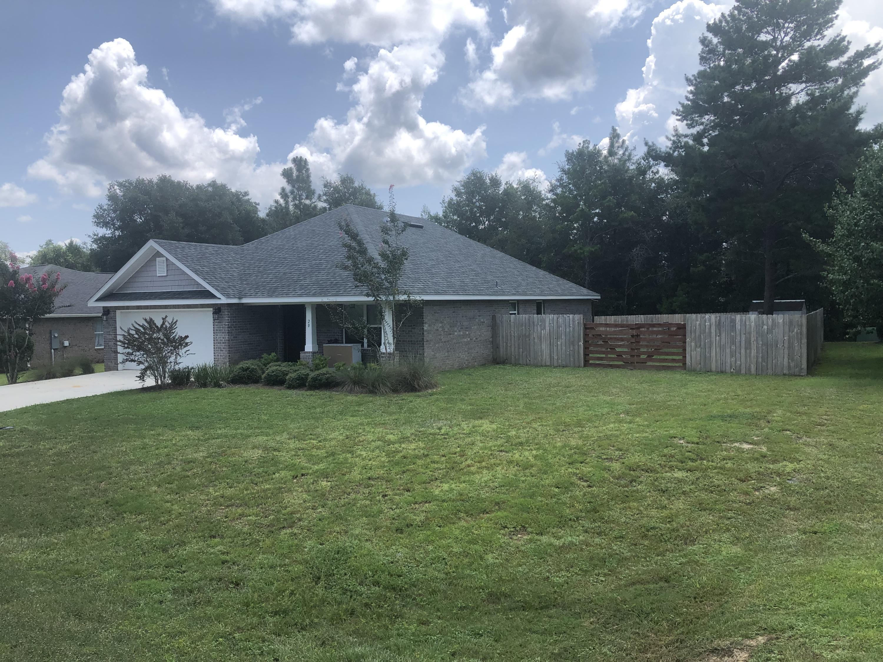 Welcome Home to this beautiful newer home in the highly desirable Magnolia Creek Estates. You will love the 4 sided brick exterior and beautiful Hardwood floors in the common areas with tile in kitchen and baths. The open floor plan is perfect for family gatherings and the fenced back yard with covered patio make this feel like home. Magnolia Lakes Estates has a wonderful common area with a gazebo on the lake perfect for birthday parties or just relaxing and watching the sun set. Home is within walking distance to Maude Saunders Elementary School and Walton High School. Make your appointment today to view this home before it is gone.