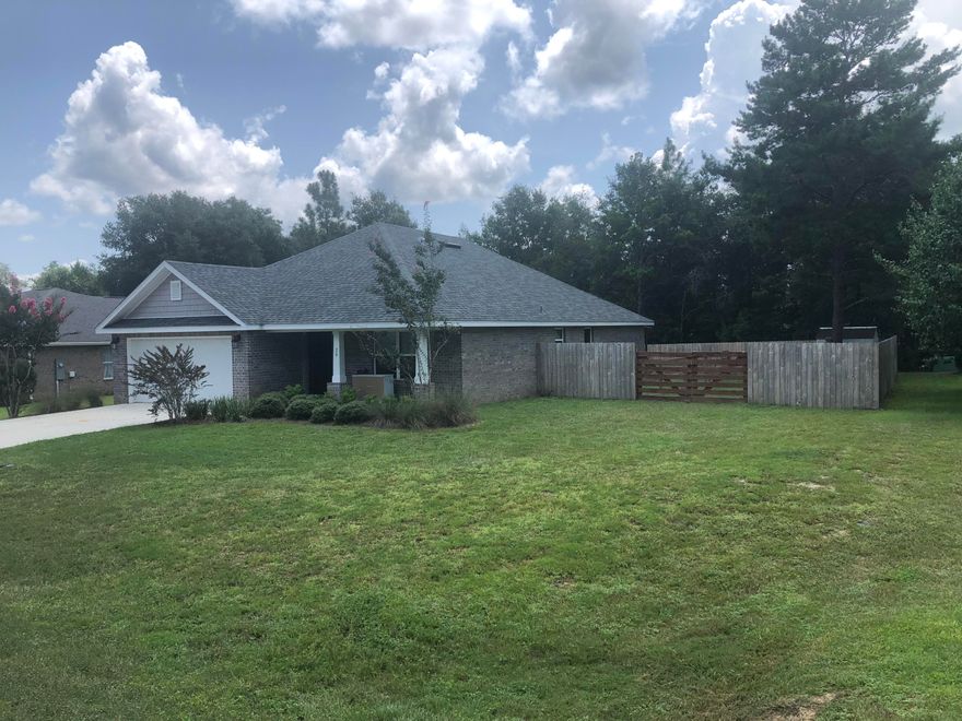 Welcome Home to this beautiful newer home in the highly desirable Magnolia Creek Estates. You will love the 4 sided brick exterior and beautiful Hardwood floors in the common areas with tile in kitchen and baths. The open floor plan is perfect for family gatherings and the fenced back yard with covered patio make this feel like home. Magnolia Lakes Estates has a wonderful common area with a gazebo on the lake perfect for birthday parties or just relaxing and watching the sun set. Home is within walking distance to Maude Saunders Elementary School and Walton High School.  Make your appointment today to view this home before it is gone.