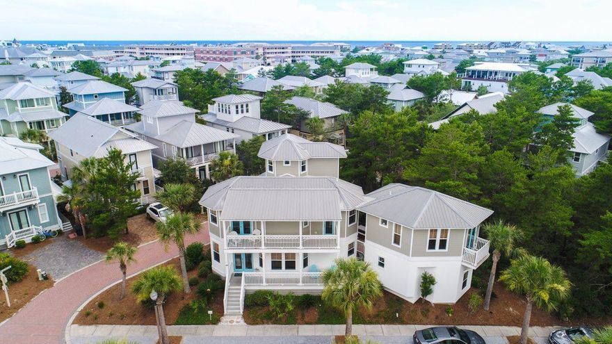 Situated on a corner lot with an abundance of natural light, this Seacrest Beach home provides plenty of entertaining space and is located within walking distance to several amenities. An ideal home for a large family, the main house offers three bedrooms with one located on the first floor, a bunk room and a separate third floor living or sleeping area. A carriage house with an additional bedroom, kitchen, and a one-car garage for added storage space or vehicle parking. Well-maintained, this home features hardwood floors in the main living areas, an open floor plan, stainless steel appliances, a spacious dining area, and bamboo window treatments throughout.