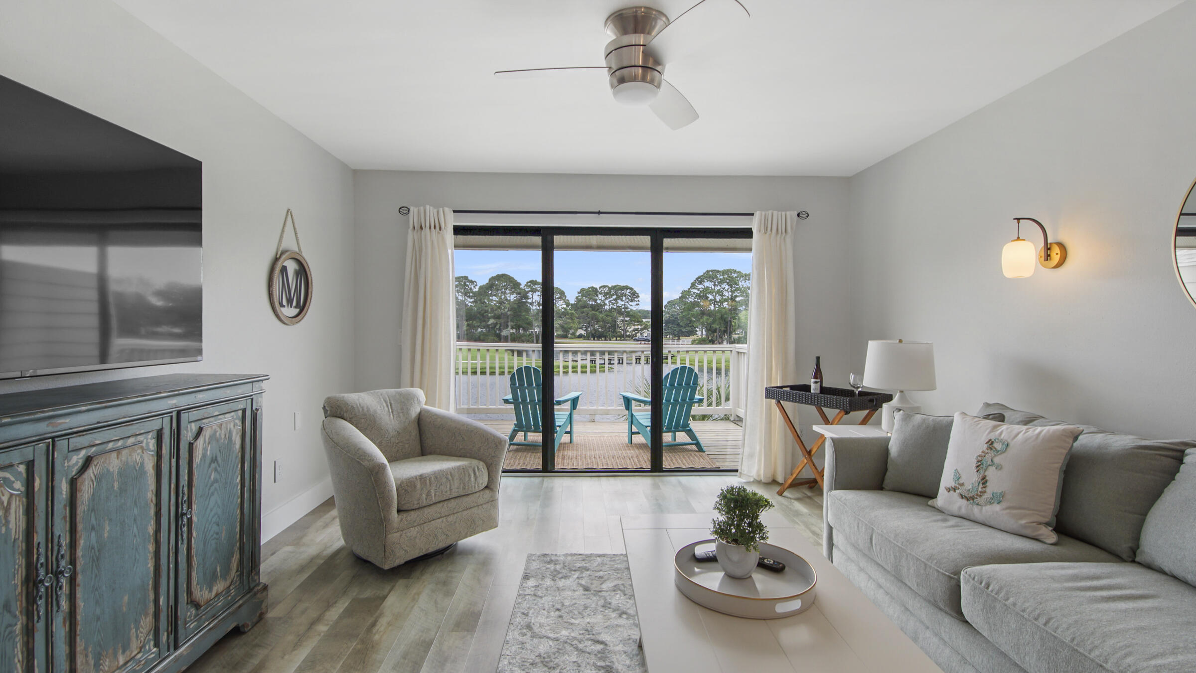 Located on the Links Golf course, this coveted top floor corner unit is the one you have been waiting for...You will be wowed by the panoramic spectacular lake and golf course views. Imagine relaxing and enjoying the gentle warm breeze while watching the amazing sunrises and sunsets. Decorated in a coastal luxury theme, you will find lp flooring, new paint throughout and all brand new furniture from Tuskers. The open floor plan features water views from the kitchen, dining and living room. The well appointed kitchen has granite countertops, stainless steel appliances and 2 breakfast bars with Serena & Lilly barstools. The master bedroom offers brilliant natural light with a partial water view.