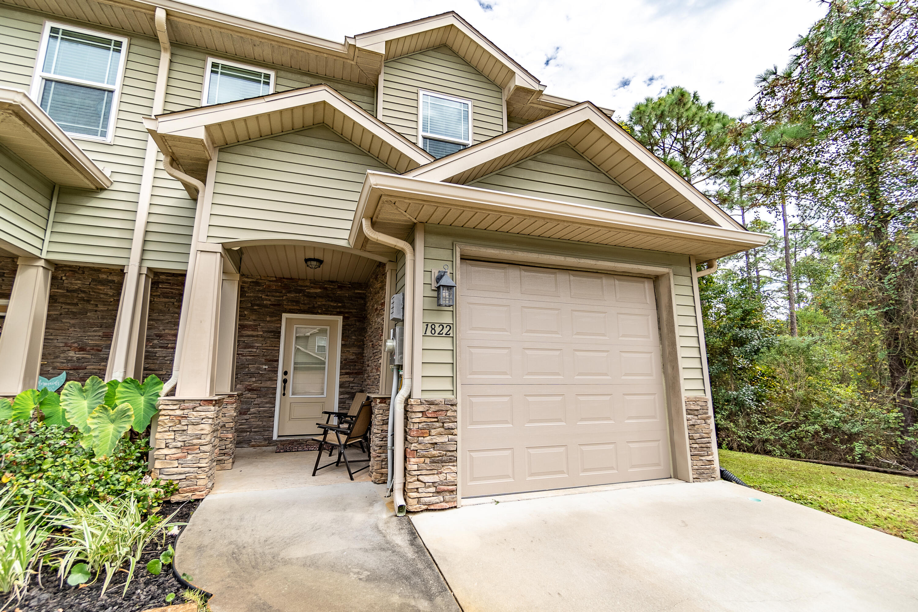 Highly desired end unit and meticulously kept, this townhouse features upgraded tile flooring, master bathroom and has been recently painted. The home is booming with natural light, features a countertop bar with seating space for four, a fully fenced-in back patio for privacy, and is not in a flood zone for added peace of mind. The property features a community pool and underground utilities for added curb appeal. Enjoy the view of the Santa Rosa Sound as you take an evening stroll. Along with a beautiful home, you also have a great location. Just a short drive away, you have the sandy white beaches and expanding downtown Navarre with shops, restaurants, and more.