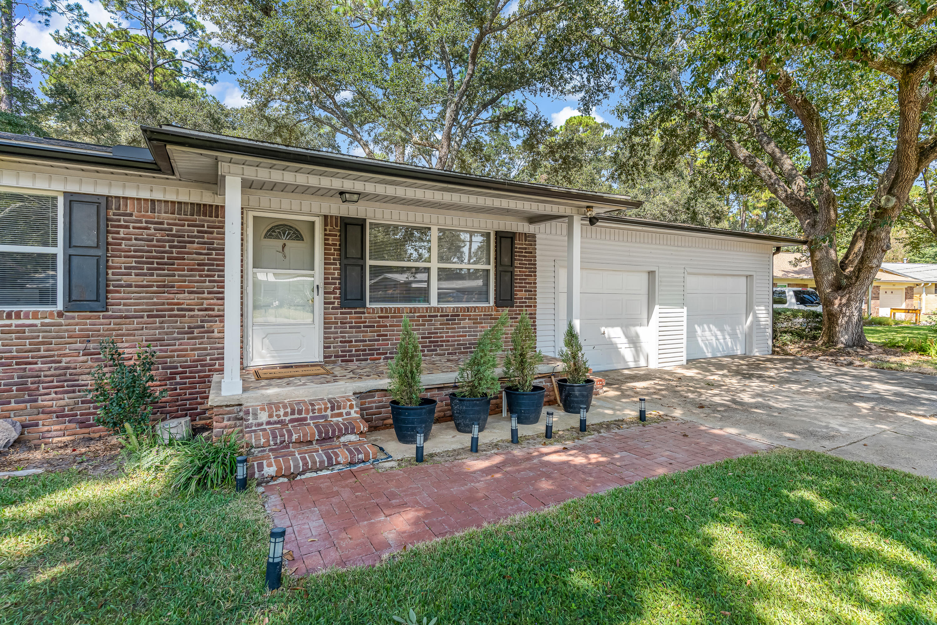 AFFORDABLE and MOVE- IN READY! Don't miss this home with the character of original wood floors and updates you'll appreciate! The interior walls, baseboards and doors have just been freshly painted. The main bathroom was completely renovated (2023) with a glass/tile walk in shower, new floors, fixtures and shiplap wall. Bonus - plenty of HOT water from the tankless water heater (2018). The eat-in kitchen leads out to a spacious backyard with privacy fence. There's plenty of space for dogs, gardens, a POOL and more! Take note of these updates - roof 2018, HVAC 2017, electrical 2018 and gutters 2022. Plus, the washer and gas dryer stay for you! Work from home? Live Oak Fiber and AT&T Fiber are available for excellent connectivity. Close to Hurlburt, Eglin, golf and the BEACH!