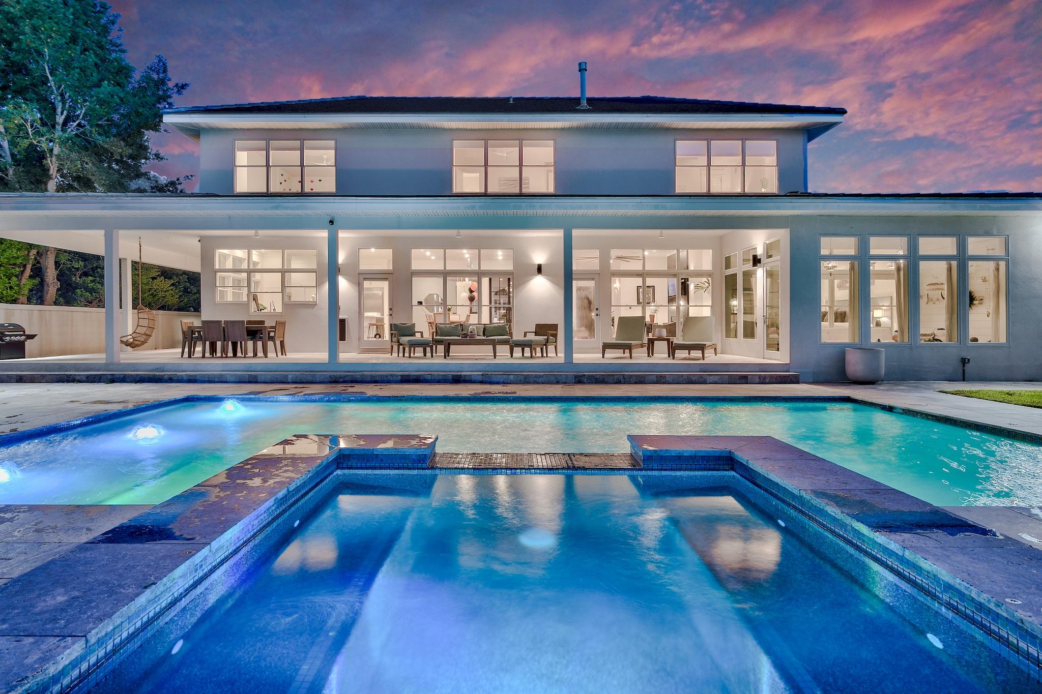 This is a show stopper! Incredible Bayfront home in the prestigious gated golf community of Emerald Bay that is sure to impress! From the moment you walk in you will notice pride of ownership and attention to detail throughout. Boasting an open floor plan coupled with tall ceilings and large windows overlooking the new pool, sun deck and dock all the way to the bay. This home has been completely remodeled. This custom home is stunning and functional. The bright dream kitchen has ample storage and includes a walk in pantry with professional stainless series kitchen appliances. The phenomenal outdoor living space with a beautiful landscaped yard includes a large custom pool, fire pit, covered porch and dock with boat lift. You will see some of the most incredible sunsets from this home.