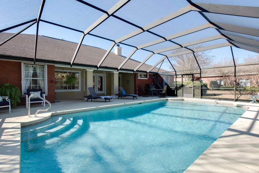Custom Built 4 BR/3 full bath with an office 'all brick'  home with large screened in pool in the Baywinds Golf Estates neighborhood of Emerald Bay. The home features an open living room with a formal dining room, 12 ft ceilings, crown molding, and an office with built in desk and shelving. An open kitchen with breakfast area and a split bedroom floor plan. The master bedroom has an ensuite bath with double vanity, jacuzzi tub and separate shower and two walk-in closets. Your covered back porch and large screened pool area are great for outdoor entertaining. Features an oversized two car garage and hurricane shutters with manicured  landscaping.  Emerald Bay Golf Club memberships are available for the homeowner who would like access to golfing and the club.