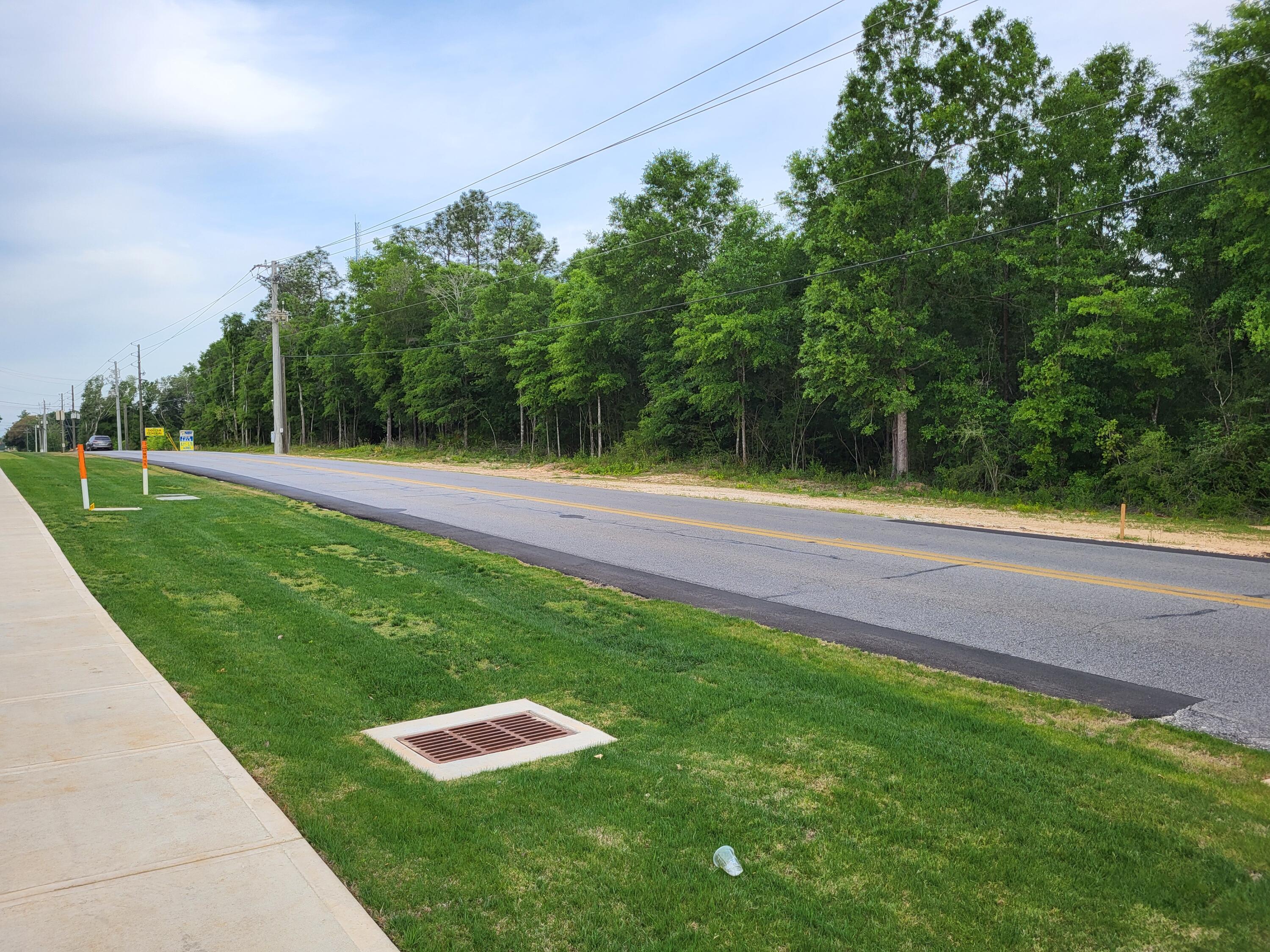 Price Reduced over $80,000 motivated seller. 6.8 acres zoned C-1 Commercial in the City of Crestview, 350 feet of paved road frontage, property slopes to the rear, all wooded. Located near the Hospital, Walmart, and Interstate 10. Eglin Air Force Base, Duke Field, and the Army Special Forces are large employers in the area. Population of 48,453 within 5 miles.