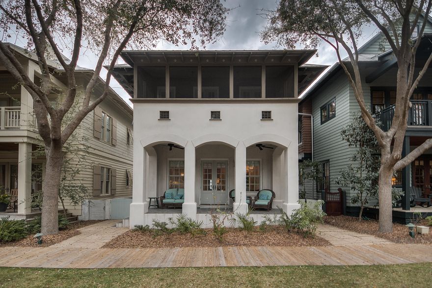 Tucked neatly along one of Rosemary Beach's coveted pocket courtyards is where you find this charming beach cottage that has been completely renovated and newly furnished. Graced by double front porches perfect for enjoying the park-side tranquility, this three plus bedroom home will neatly satisfy the longings of your family for a home in Rosemary. As you enter, you sense a bit of old New Orleans ''shotgun style'' in the way the house is open from front to back. Wire brushed oak flooring runs seamlessly throughout and tall ceilings heighten your senses. There are exterior shutters on the first floor side windows to let light in yet allow for privacy. The main living, dining and kitchen flow gracefully together to enhance the openness and allow the chef to take in the beautiful courtyard