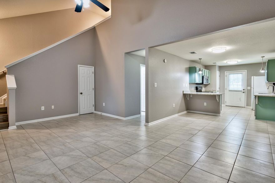 Recently renovated unit at Quail Hollow located in the heart of Destin. Just completed renovations to this fantastic unit include new granite counters, Moen fixtures, all new tile downstairs, all new Pergo laminate wood floors on the stairway and upstairs, newly painted walls and cabinets, new LED lights, new blinds, new fixtures and hinges, Baldwin locks, and new washer and dryer! The kitchen is a baker's dream with tons of counter space. Conveniently located right across from the community pool and offering a single car garage, back porch, and plenty of guest parking. This unit will make for the perfect home or investment property as these units rent very easily. Come take a look! Buyer to please verify all information contained herein, including room dimensions and square footage.