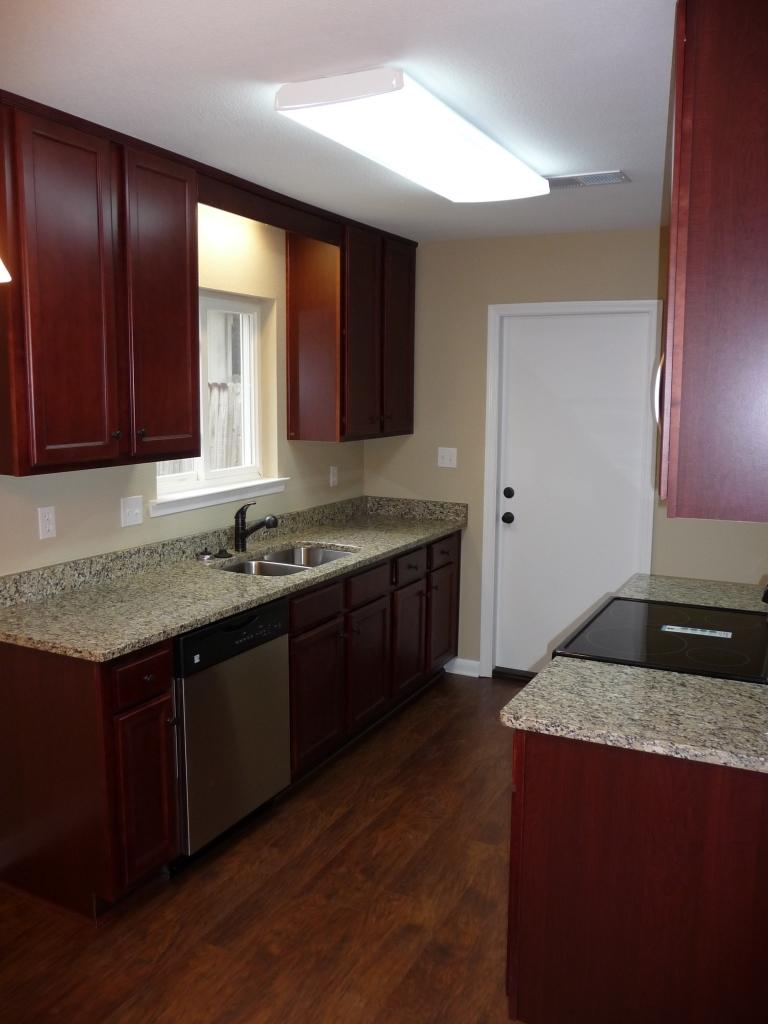 Beautifully remodeled home in the center of Niceville. 3 bed 2 bath close to the highly credited middle school and high school. Interior has been upgraded with knock down ceilings, recessed lighting, new wood laminate flooring, new carpet in all the bedrooms, new lighting throughout, and new doors throughout. Kitchen has been upgraded with new cabinets, granite countertops, stainless appliances. Bathrooms, have been updated with new tile flooring, new vanities, new, lighting and fixtures. Home has a new 2014 roof. Large shed that has power, large back yard, large wood deck to relax on. New Landscape going in this week.