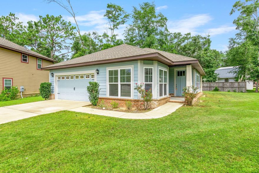 Adorable Craftsman Cottage in The Canopies. This 3 bedroom, 2 Bath home is conveniently located in the heart of Freeport, close to schools, 5 minutes to Publix, and 20 minutes to beaches. 8-foot exterior doors open into the home and    LVP flooring flows in the living room, kitchen and dining area. The kitchen has stainless steel appliances, granite counters, and beaded cabinets. The master bedroom has access to the back patio and a trayed ceiling.  Be sure you check out the community pool and playground that's just down the street. You don't want to miss this opportunity.