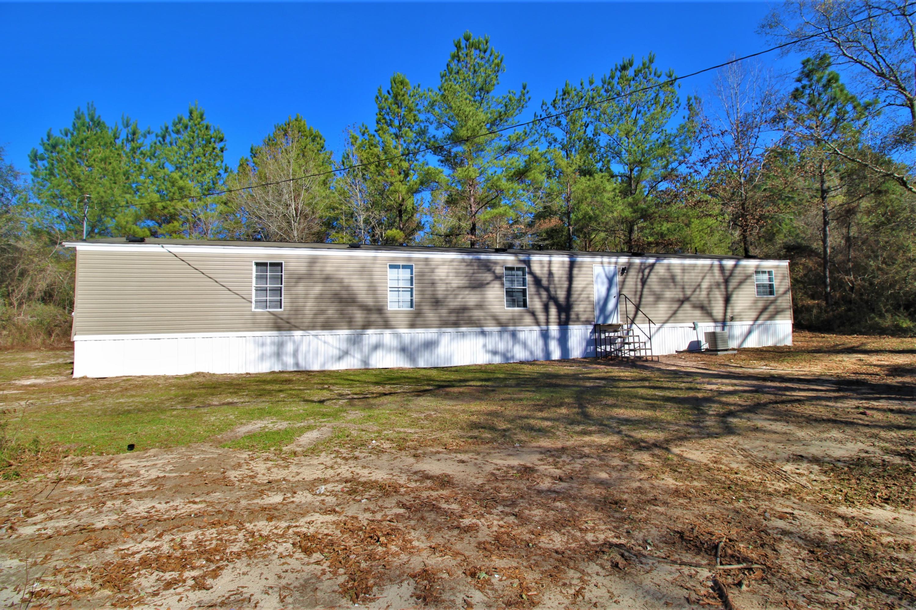 REO AS-IS: #CountryLife! Set on 5 private, wooded acres, this home has 3 bedrooms, 2 full baths, open kitchen/living area, an office nook, & a large walk-in utility room. The master suite is complete with walk-in closet, over-sized tub, double bowl sinks, & a separate shower. **SELLER FINANCING POSSIBLE**all measurements approximate**