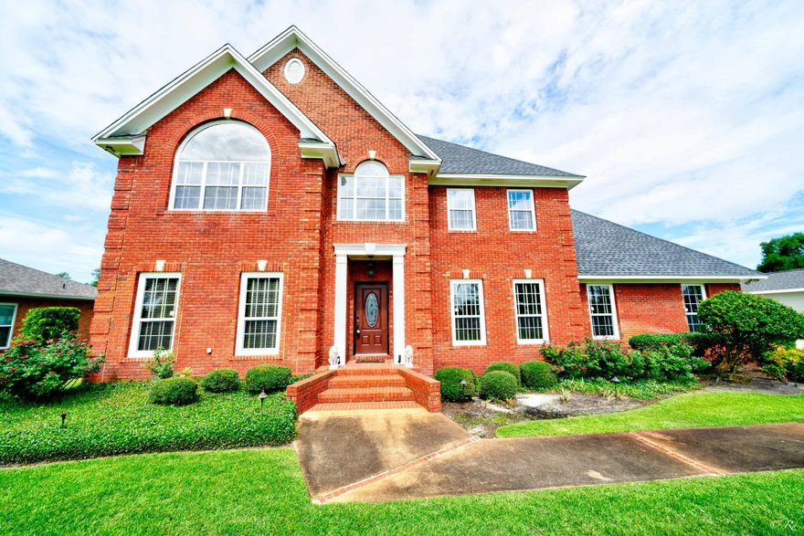 This beautifully landscaped, brick home is located in the much desired King's Point subdivision. This home welcomes you in with brand new oak floors and a spiral staircase leading you up to the second floor. This home also boasts a large foyer that can be used as a study or flex space. The kitchen is equipped with high end wood cabinets, granite countertops, and stainless steel appliances. The main living area boasts tile flooring, a wood-burning fireplace, and recessed lighting. The large master bedroom is equipped with vaulted ceilings, its own private ensuite, and a huge window overlooking the gorgeous front lawn. The master bathroom boasts dark colored wood cabinets, a jetted tub surrounded with tile, separate walk-in tiled shower with a glass door, a walk-in closet and a private