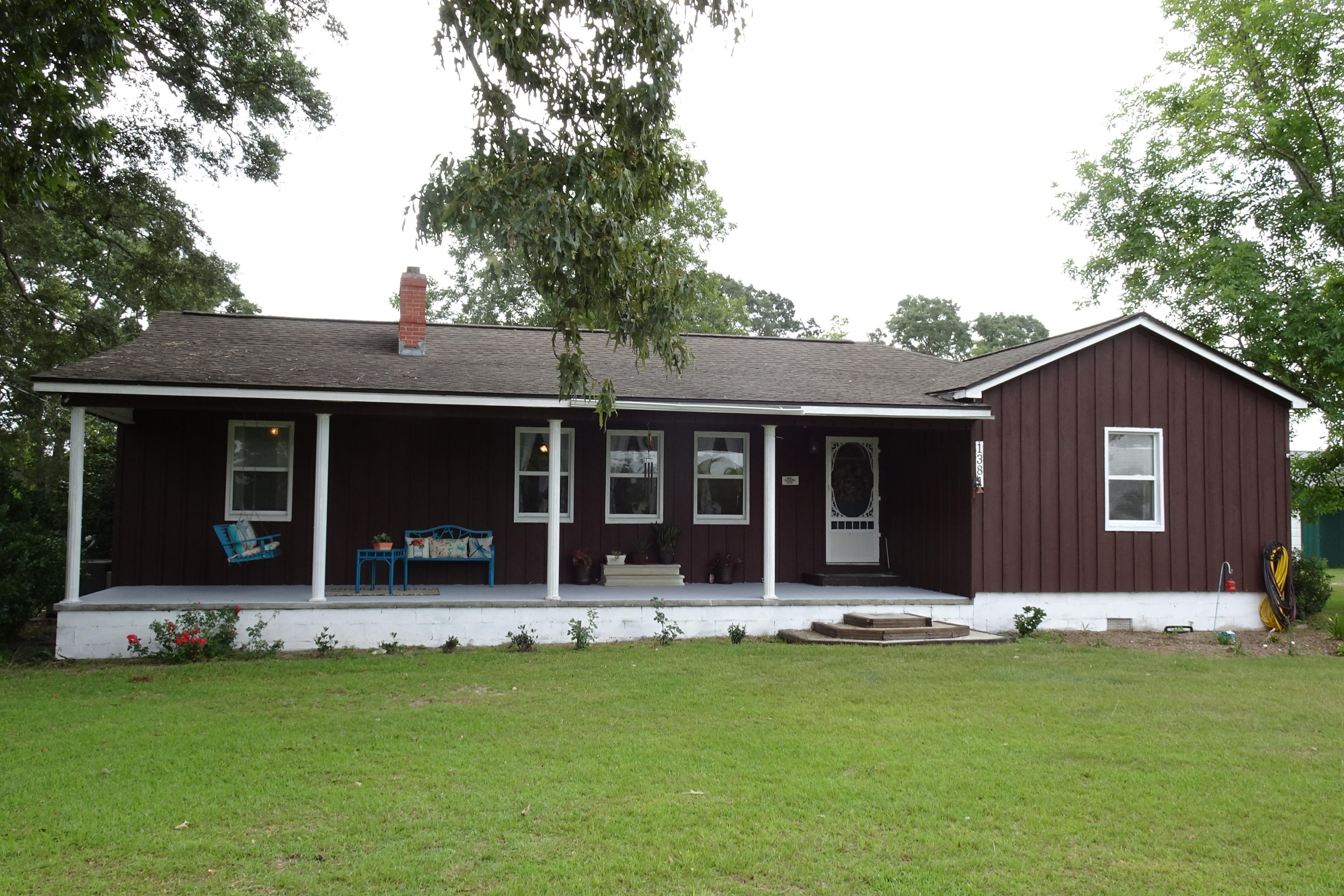 USDA, VA, FHA eligible! Roof less than 9 years old, updated appliances, impeccably maintained HVAC and hot water heater. Classic, quintessential home exuding the best in country living. Massive acreage, over 3.5 acres of the most beautiful land in north Florida containing oak trees and fruit trees dating back hundreds of years. A steady breeze blows across Wrights Creek Road because of the high elevation of this 3.5 acres. As you walk up to the front porch of this home which spans almost the entire length of the home, you are graced with a porch swing that takes you back in time to easy, peaceful living. The living roomof this property displays a soft and serene ambiance with the original fireplace, wood mantel, and brick hearth.